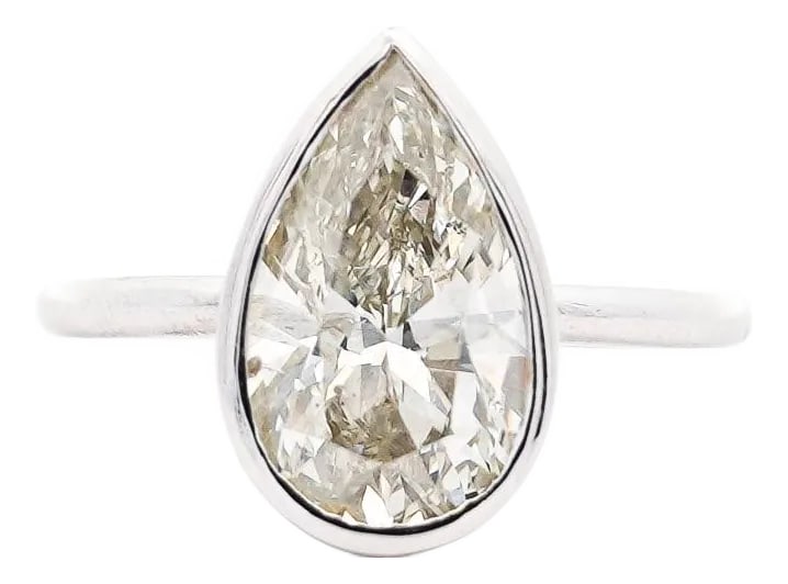 3.09 Carat Diamond Pear-Cut Bezel Set White Gold Solitaire Engagement Ring, Size 6.25: Simplistic and conspicuously valuable. This natural diamond of 3.09 carat is securely bezel set with a straight shank solitaire setting. Set in a sleek 14K white gold -effortlessly modern with