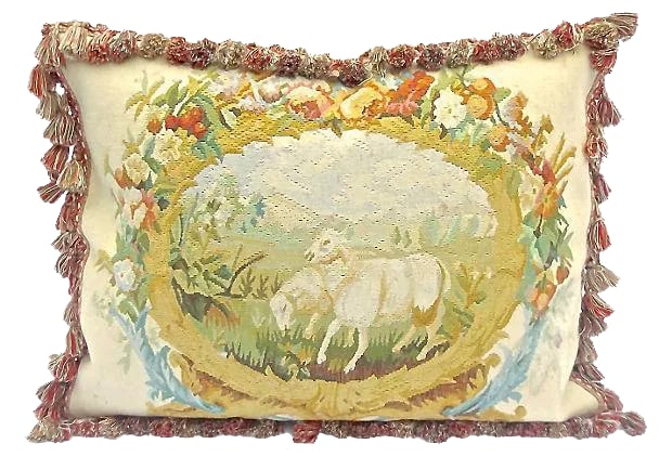 Antique Goats Floral Aubusson Pillow: Antique; 19th century, French, goat and floral, Aubusson pillow with velvet back. Grazing sheep and floral accent central design with multicolored tassel fringe. Down fill and zipper closure.