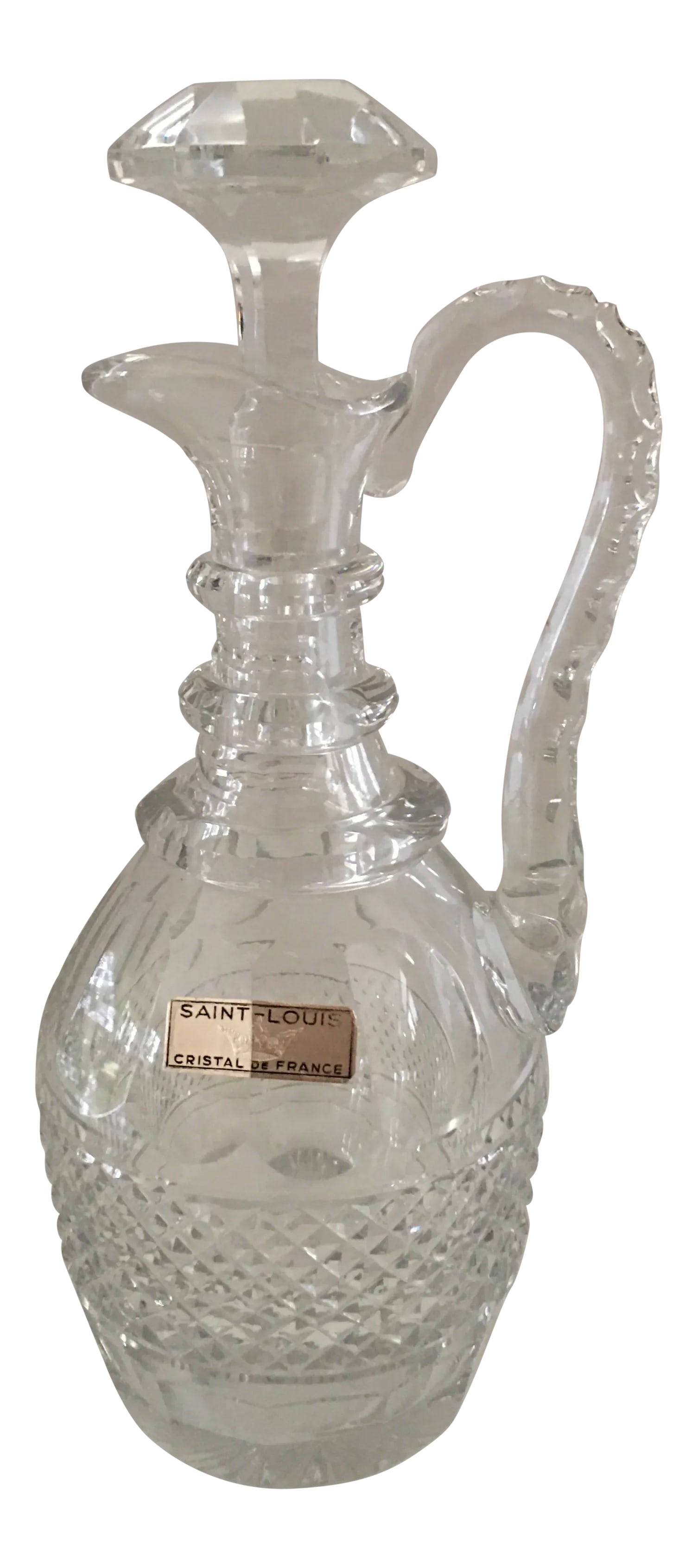 Vintage Saint Louis "Trianon" Handled Crystal Decanter, France: Stunning St. Louis crystal handled wine decanter. The pattern is "Trianon", cut cross-hatch panel design. Made in France Measures 12.25" h x 6" w x 5" d. Pristine condition. Condition: Alterations: