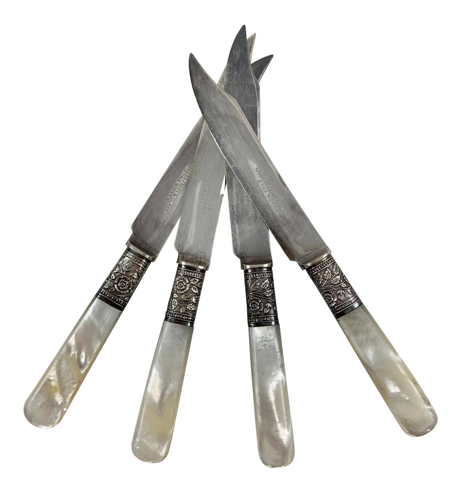 Aetna Works Mother of Pearl and Sterling Silver Collar Fruit Knives - Set of 4: From Landers, Frary & Clark - Aetna Works, founded in New Britain, Connecticut, 1866, a set of four fruit and cheese knives. Mother of Pearl handles are joined to plated blades by a Sterling Silver