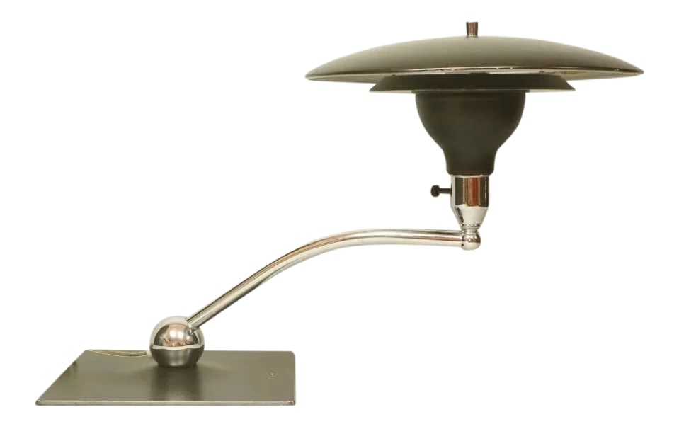 Mg Wheeler Sight Light Saucer Lamp: Novel mid-century modern Sight Light desk lamp by M.G. Wheeler. The space age lamp features a whimsical saucer shape. The design certainly captures the spirit of the era with it's UFO silhouette. The