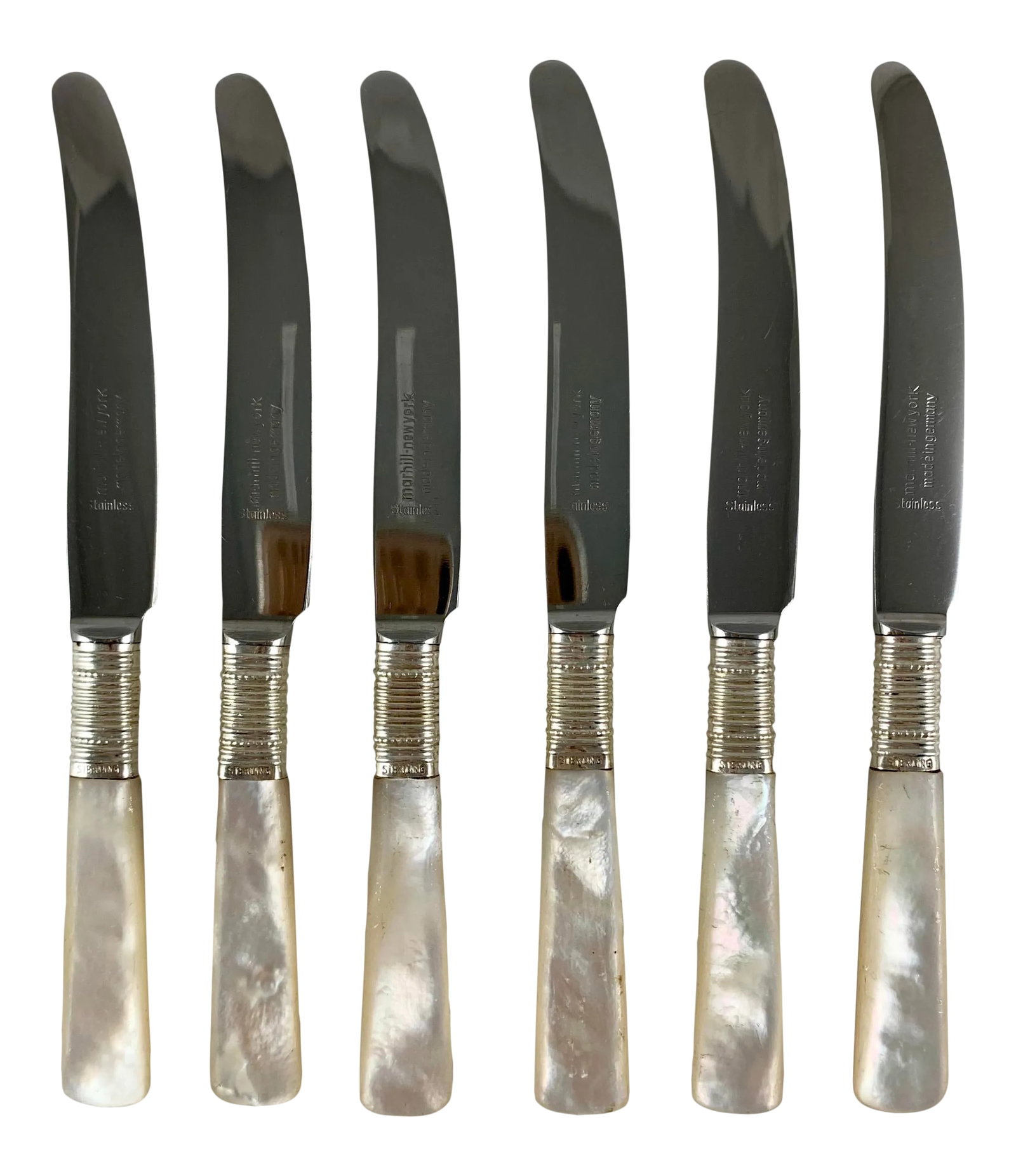 1920s Marhill of New York Mother of Pearl and Sterling Silver Spreaders, a Set of Six: From Marhill of New York, an Art Deco period set of six spreaders, made in Germany, circa 1900-1920. Mother of pearl handles are joined to stainless steel blades by a sterling silver ferruled collar