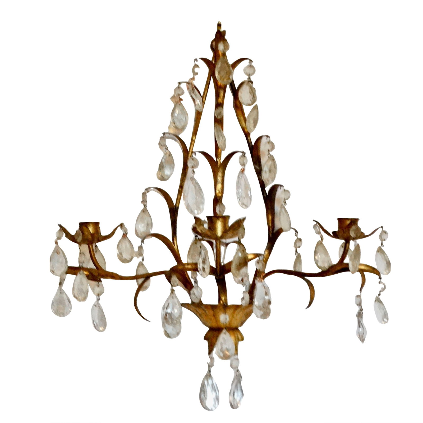 Italian Tole Gold Triple Arm Candle Wall Sconce With Crystals: A lovely Mid 20th-Century Italian tole triple arm candle sconce with prism cut crystals. It has a decorative center embellishment and holds 3 candles. It has a gilt finish and would be beautiful