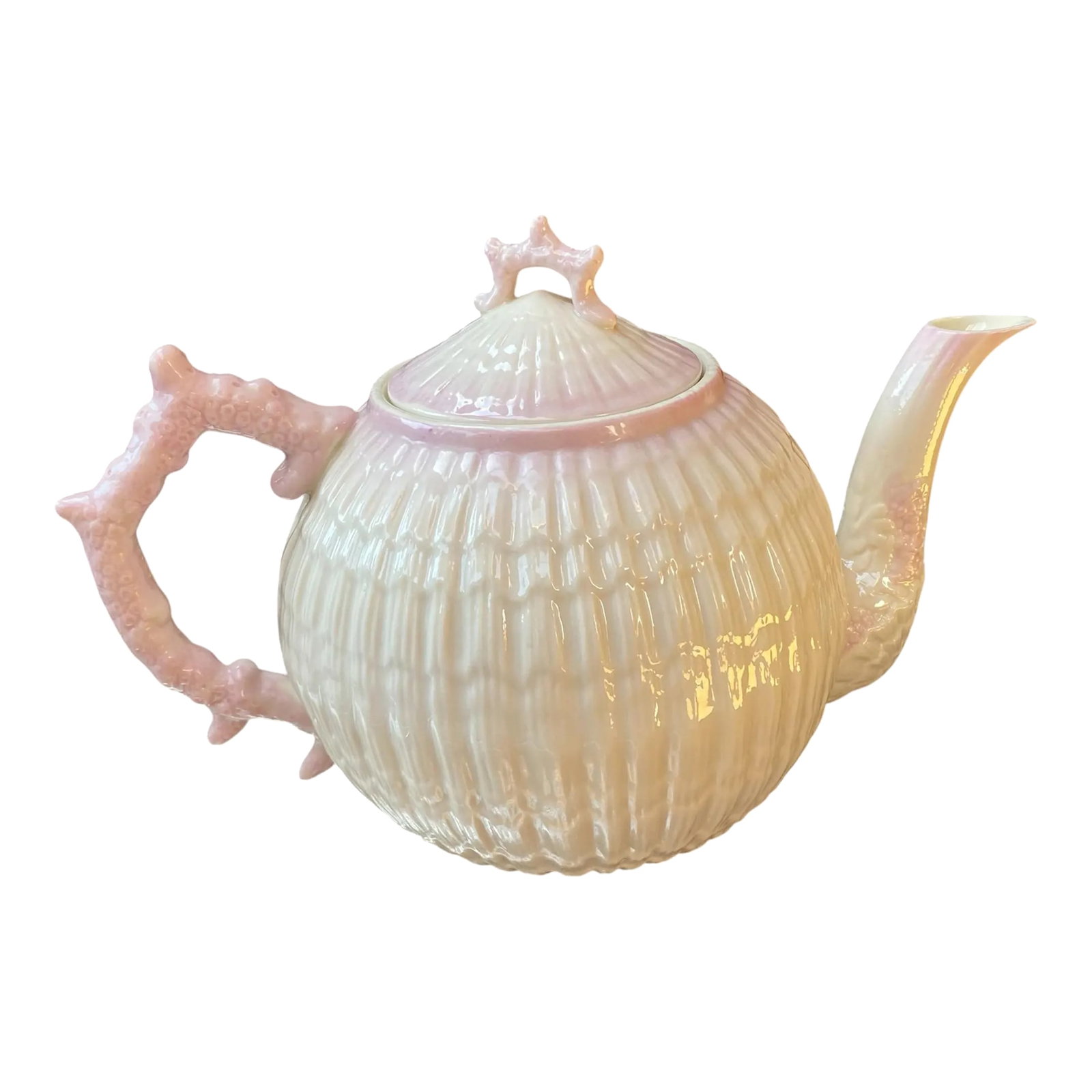 Belleek Limpet Pink Teapot, Fairycore Style, 1965-1980: An outstanding example of late 21st century Belleek pottery with a hint of fairycore style. Porcelain teapot in the Limpet (shell) pattern with accents of pale pink. The body of the pot is made to