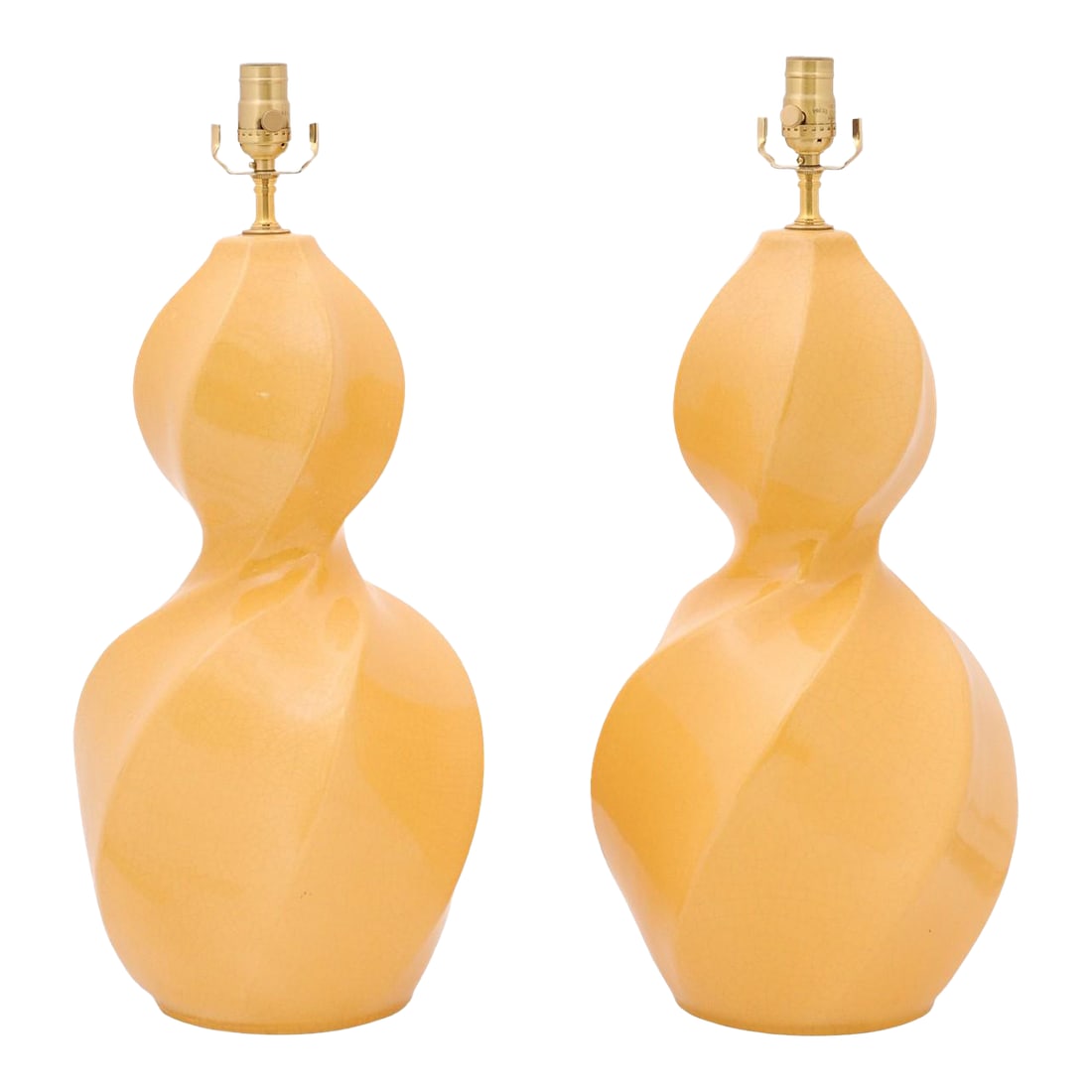 Beautiful Yellow Crackle Ceramic Double Gourds, Circa 1970s: A sculptural pair of Mid-Century Modern ceramic table lamps, featuring a bold double-gourd silhouette with a dynamic twisted form. Finished in a warm golden glaze with subtle crackle detailing, the