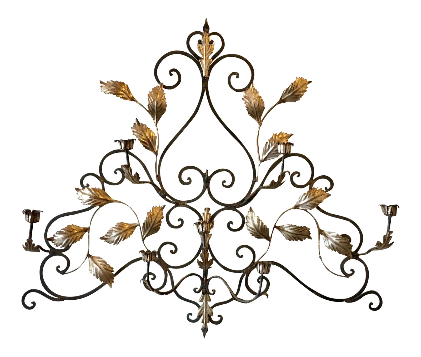 45" Italian Metal Wall Candelabra Sculpture: Large Italian decorative iron candelabra wall sculpture. Natural metal finish with silver leaf accents. 45" Wide Would be lovely over a bed or fireplace mantle. Holds seven taper size candles.