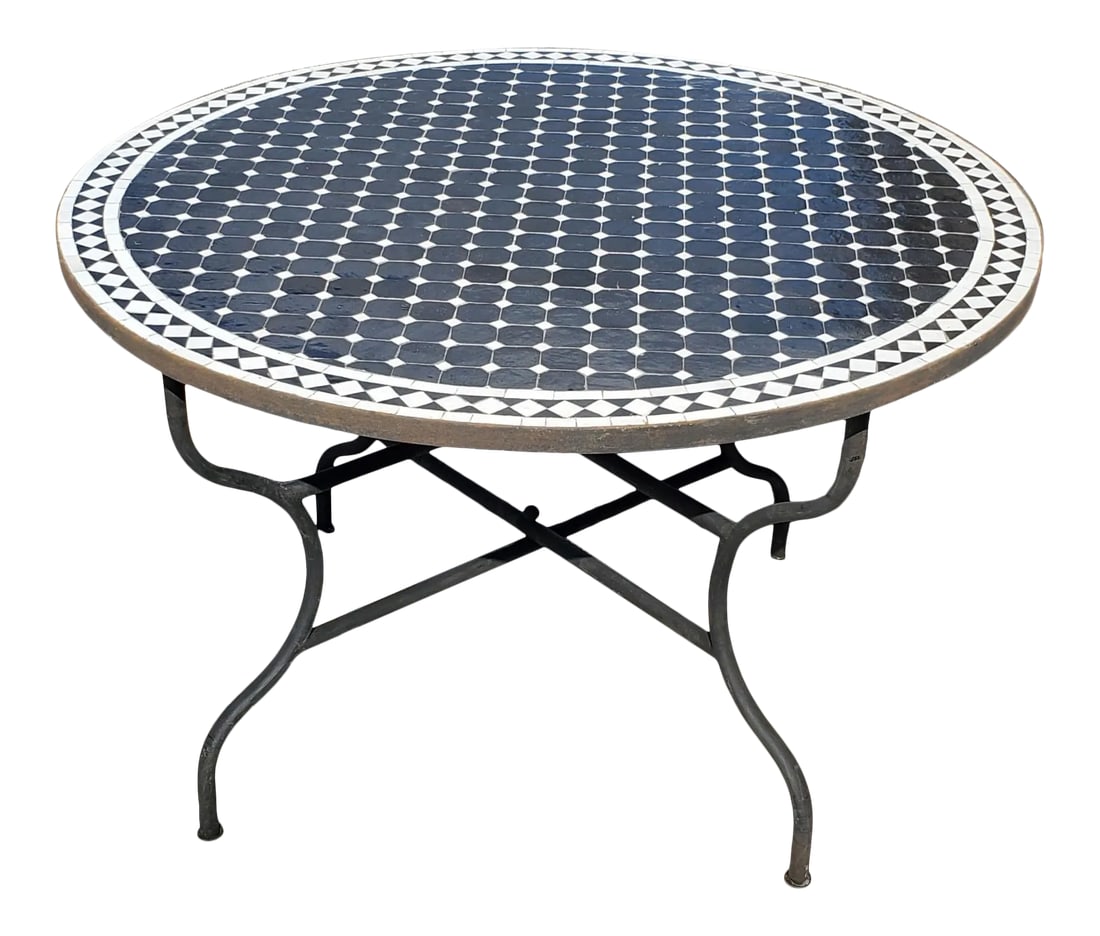 48" Moroccan Black and White Round Mosaic Table: Custom made glazed Moroccan mosaic table measuring 48" in diameter. An indoor or outdoor dining table that sits up to six people. The tabletop showcases an intricate Cr4 pattern, one of Morocco's