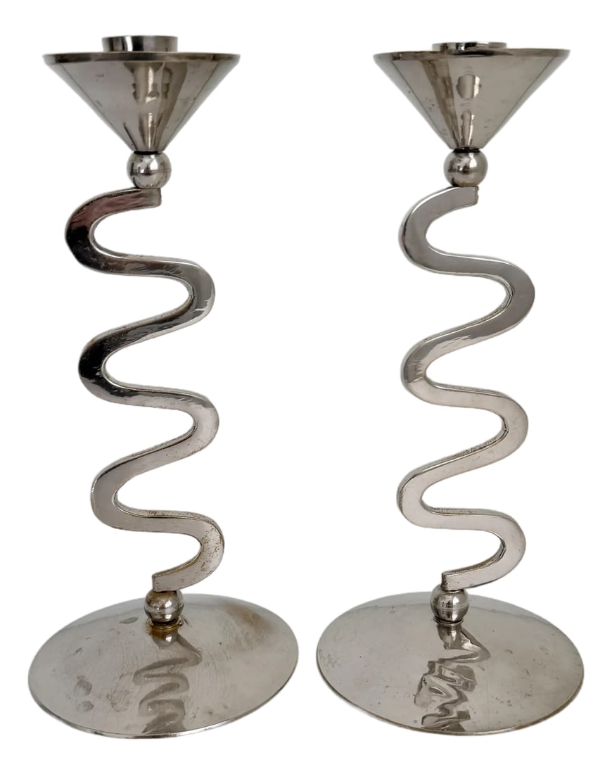 1980s Memphis Style Zig Zag Chrome Candlesticks - A Pair: A pair of Postmodern, Memphis Style taper candle holders featuring a zig zag or squiggle design. Made of brass, finished in chrome. Unmarked. Condition: Alterations: Original Condition Unaltered