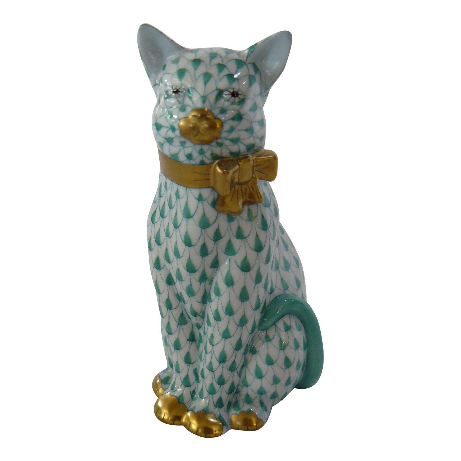 Herend Green Fishnet Cat With Gold Bow: A piece no longer available from Herend, this green fishnet Cat wears a beautiful 24K gold bow and stands an impressive 5" tall. No visible signs or wear or use. Excellent condition! Condition: