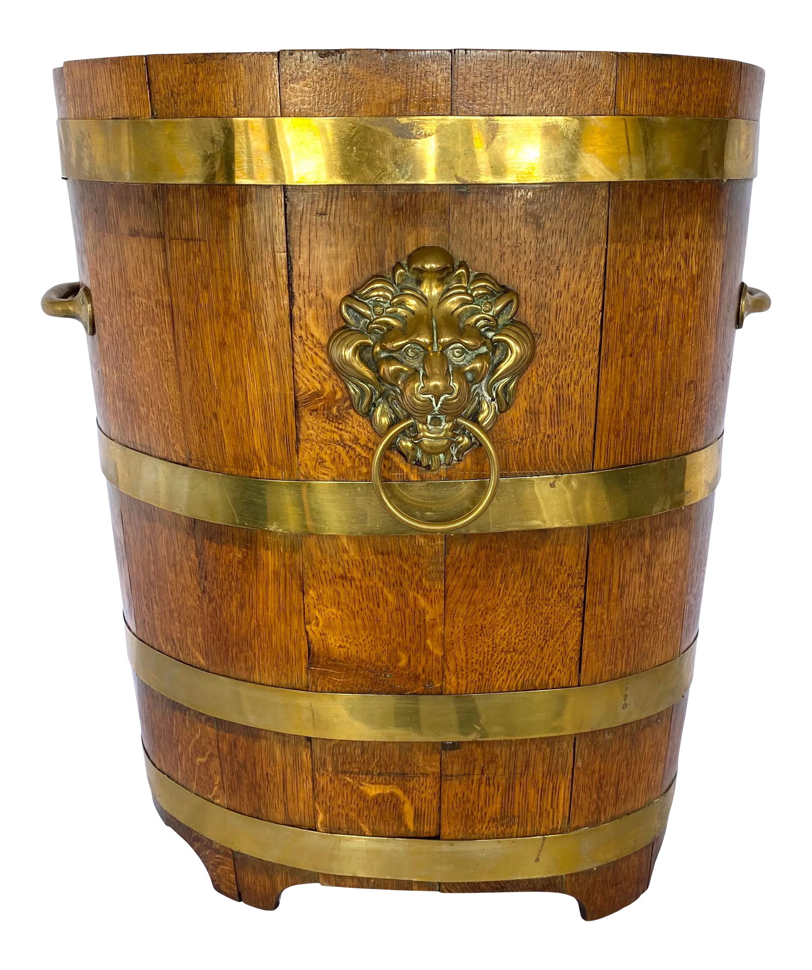 Late 19th Century English Oak Barrel With Brass Bands Umbrella Stand: Late 1800s English oak artisan crafted barrel with thick brass bands, two handles and a lion's head medallion. Created with vertical planks of oak mitered and fitted to create the oval shape. Sits on 
