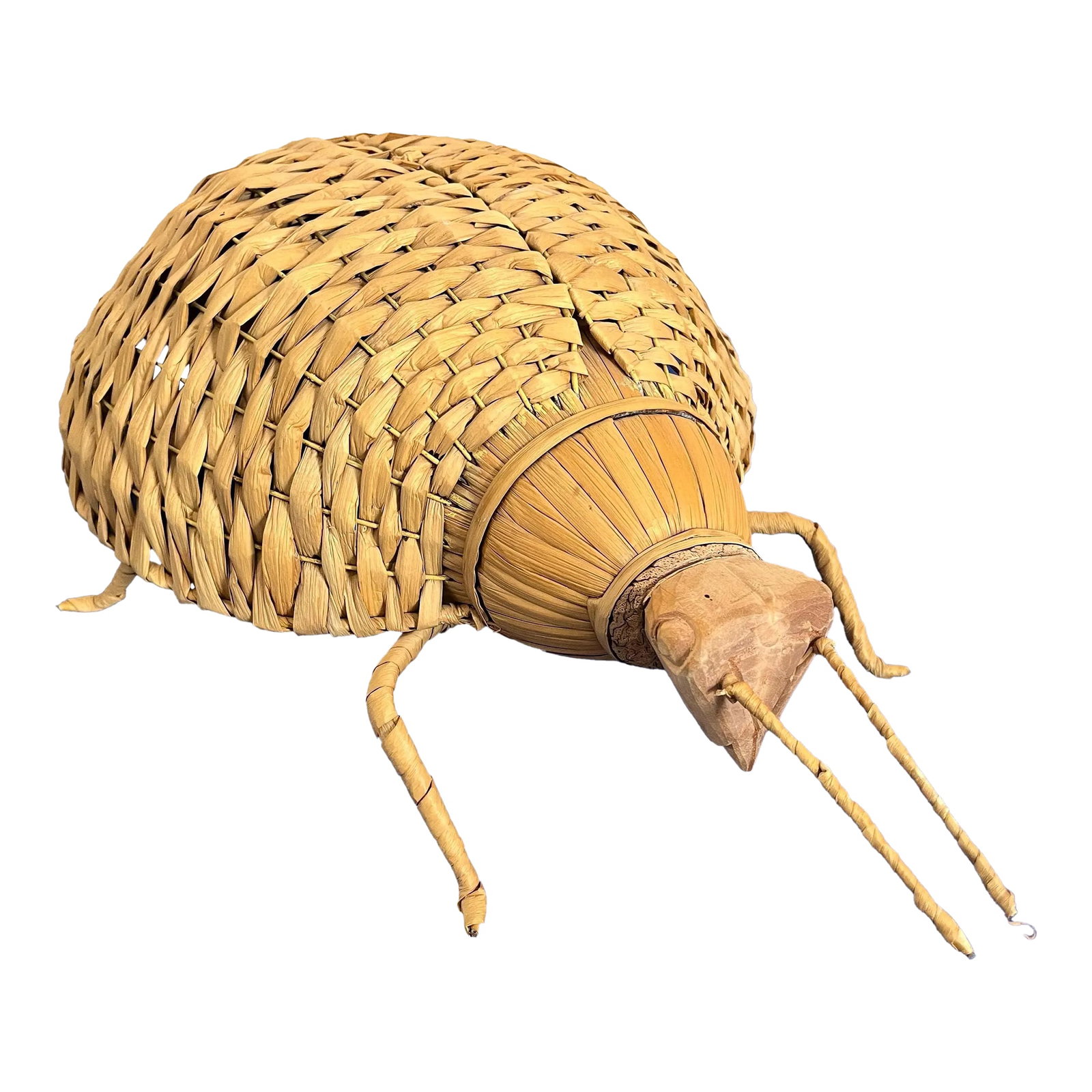 Giant 1970s Wicker Beetle: Huge whimsical wicker beetle hand crafted of natural reeds and carved wood woven around a metal frame with lifelike antennae, suspended carapace, legs, and abdomen. Imported from the Philippines in th
