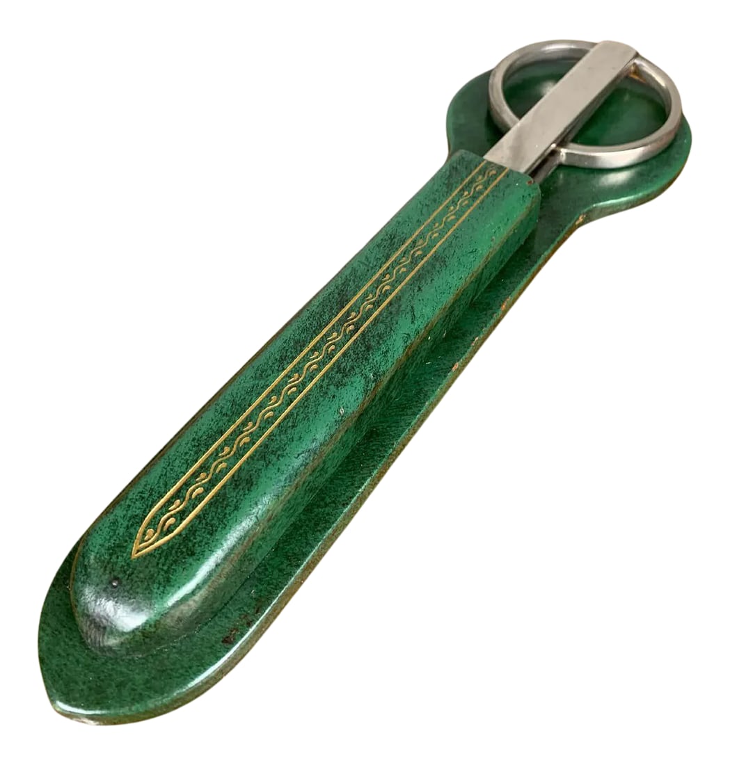 Scissor, Letter Opener, Leather Desk Set: Gold leaf design on bankers green leather holder with nickel plated letter opener and D shaped handle forged scissors. Condition: Alterations: Original Condition Unaltered Imperfections: Some