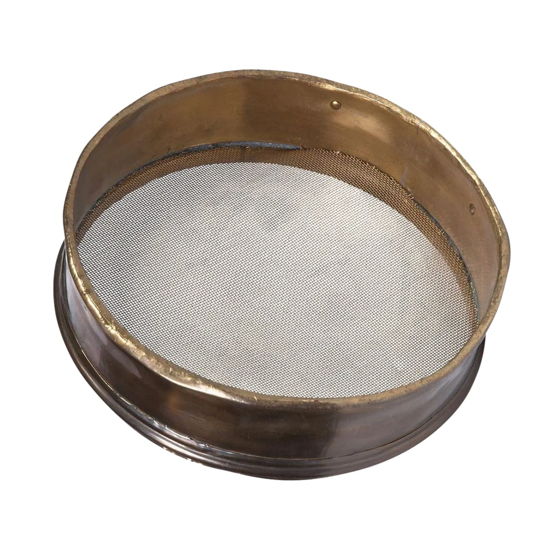Vintage Brass Sieve: This vintage sieve serves as a refined tool that is designed to delicately filter out any unwanted clumps or sizable particles. Condition: Alterations: Original Condition Unaltered Imperfections: