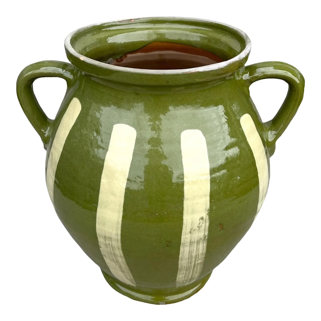 Late 20th Century Green Glazed Earthenware Vessel: Beautiful in both its shape and decoration, this vintage glazed earthenware vessel is distinguished by its two handled design, playful yellow-hued vertical stripes, and striking green glaze.