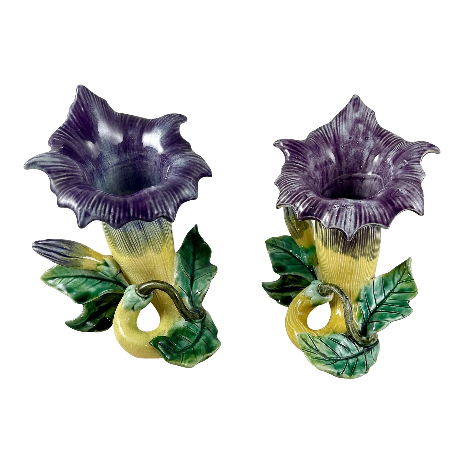 French Fives-Lille De Bruyn Purple Trumpet Vine Posy Vases, Circa 1890 - a Pair: From the French faiencerie Five-Lille de Bruyn, a pair of Art Nouveau floral form posy vases, circa 1890. The majolica glazed barbotine vases are modeled as a blooming trumpet vine flower. The body