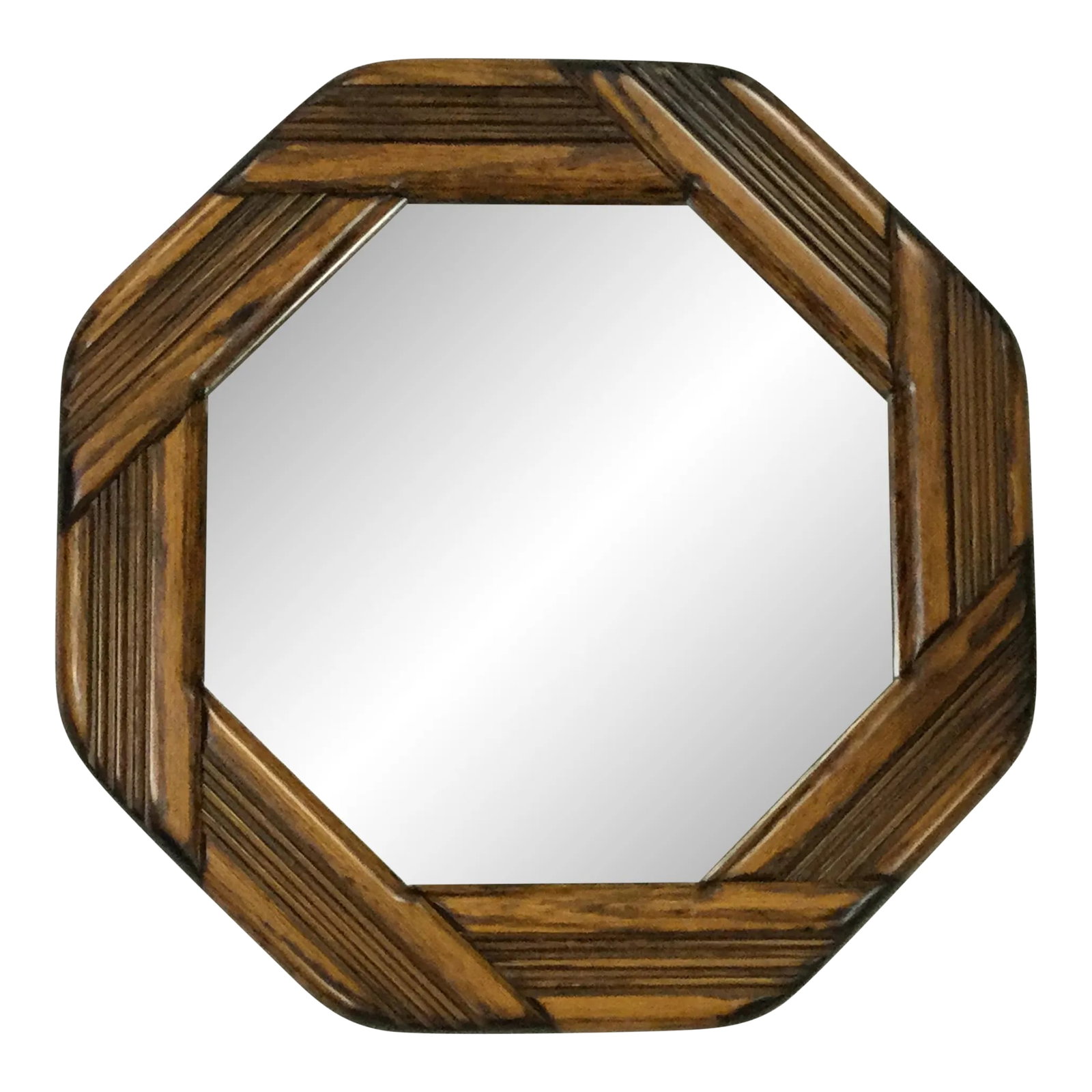 Mid-Century Arts & Crafts Boho Chic Walnut Octagonal Wall Mirror: Offering a gorgeous Midcentury Walnut Wall Mirror. The design is a wide, bold frame of eight wood panels arranged in an octagonal circle. The wood panels have deep grooves and the overall style is