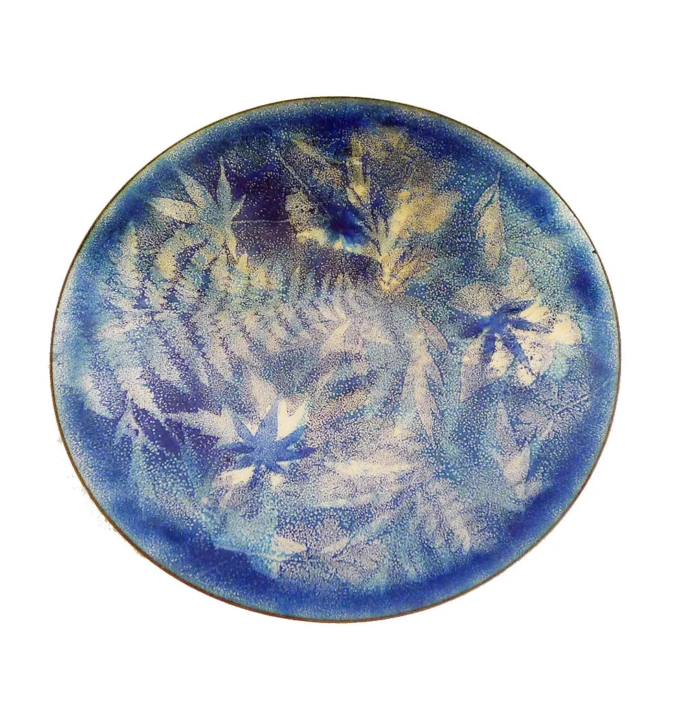 Vintage Modernist Maple Leaf Enamel Plate: Modernist enamel plate with in blues and warm silvers with a maple leaf design. An exquisite plate to bring out during special occasions or to hang as decorative art on the wall. Signed Louisa.