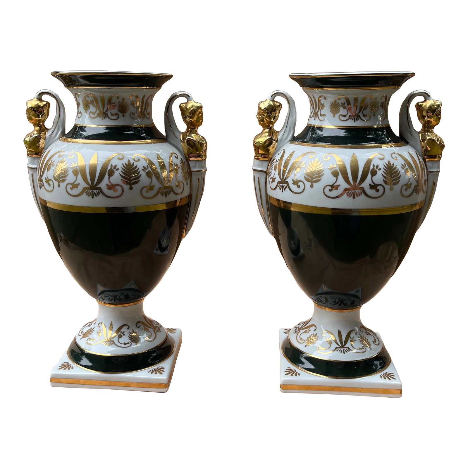 Pair of French Empire Style Forest-Green and Parcel-Gilt Pyriform Double-Handled Urns: An elegant pair of French empire style forest-green and parcel-gilt pyriform double-handled urns; each with everted neck above a bulbous body flanked by caryatid handles all over a splayed base; the