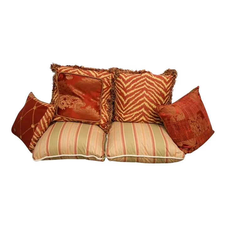 Collection of 6 Throw Pillows Some Down Filled in a Variety of Red and Taupe Fabrics: Six decorative pillows in rust/taupe/brown color range in a variety of patterns and fabrics, many down-filled. Largest measures 23" * 23", smallest 18" * 18" Condition: Alterations: Original