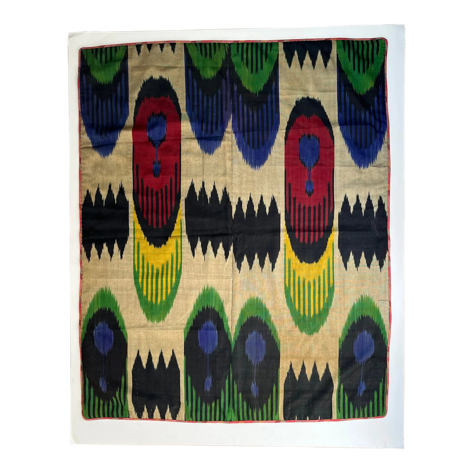 Mid 20th Century Silk Ikat Panel, Uzbekistan: Beautiful silk Ikat panel with cotton backing carefully hand stitched. Colors are very vibrant. While beautiful as a wall hanging, the fabric could be converted into a large pillow or into one or two