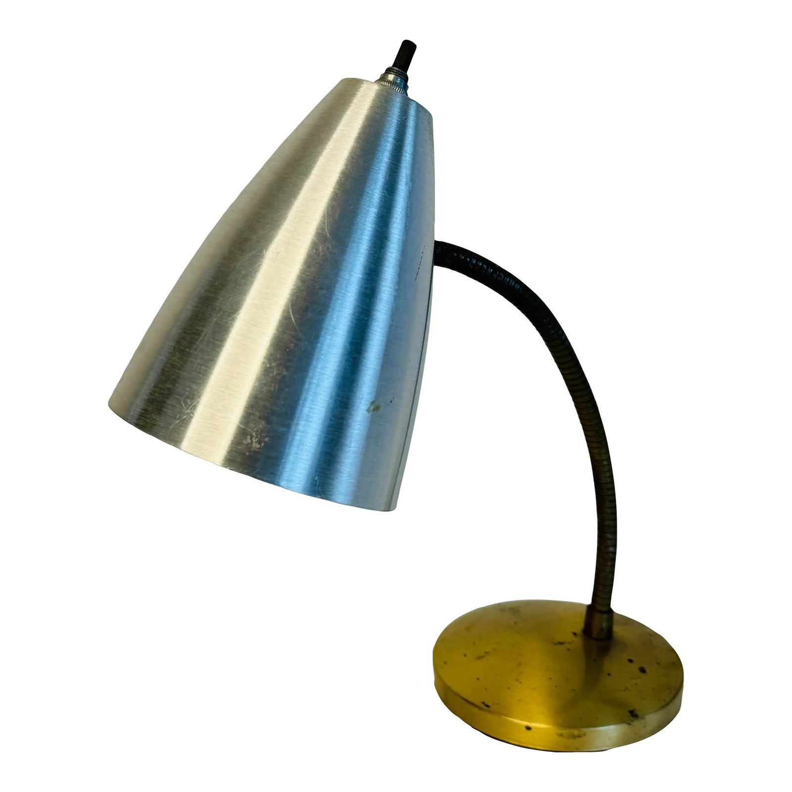 Vintage 1950s Spun Aluminum Desk Lamp: Vintage 1950s desk lamp with a spun aluminum shade. The round base is gold tone metal. Wired for the US and in working condition. Uses a standard 100 watt bulb. No marks. Condition: Alterations: Origi