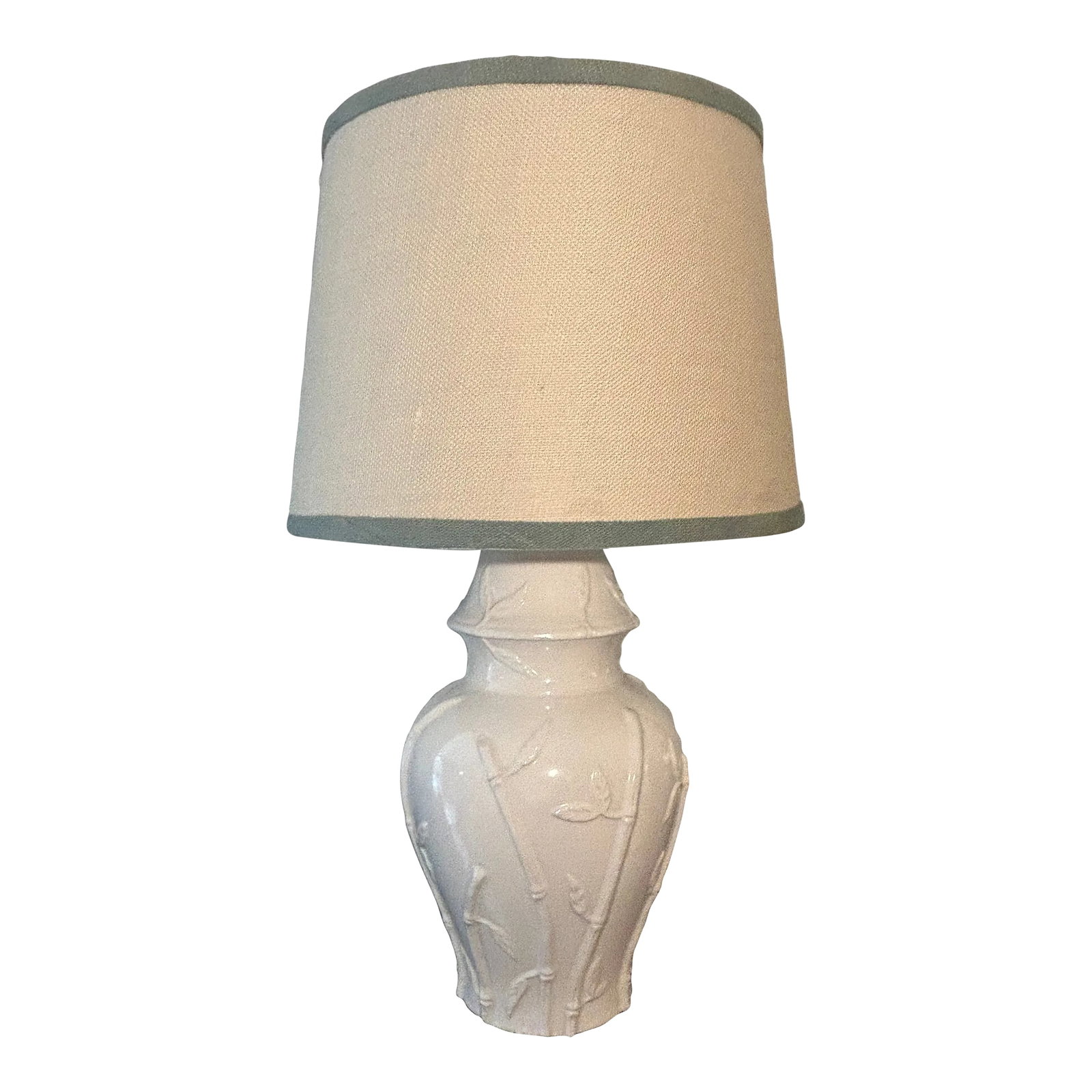 1970s Hollywood Regency Faux Bamboo Blanc De.Chine Ginger Jar Table Lamp With Custom Shade: Eye catching Blanc De Chine ginger jar table lamp with faux bamboo relief. Natural linen shade with sage green trim. Ready to plug in an light up your favorite table, desk, or credenza. Dimensions