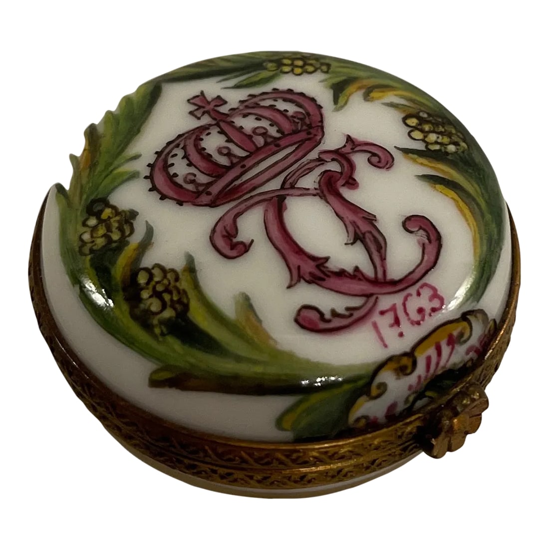 Mid 20th Century Limoges Box: A Fine French Limoges, porcelain hand painted box with metal accents and Floral clasp. The top with green foliage and yellow flowers surrounding and intertwine monogram cypher with a crown above and
