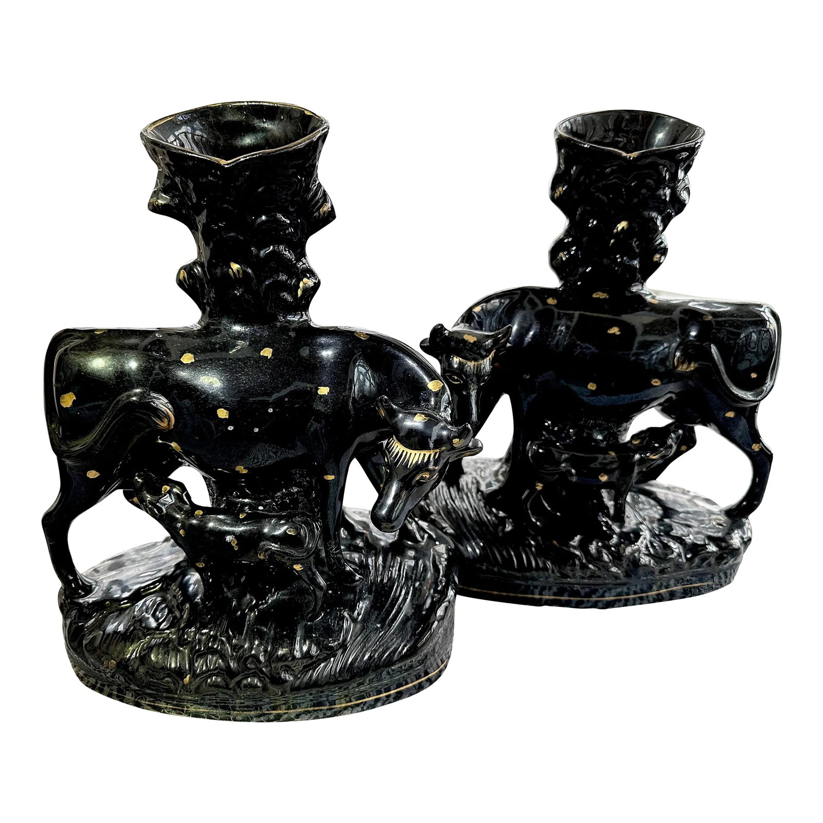 Pair of Staffordshire Cow Spill Vases in Black Glaze, 19th Century: Pair of stunning Staffordshire spill vases in cow form, rare to you find the glaze in black with gold spot decoration. These are a large size, which make them even better. England, 19th century.