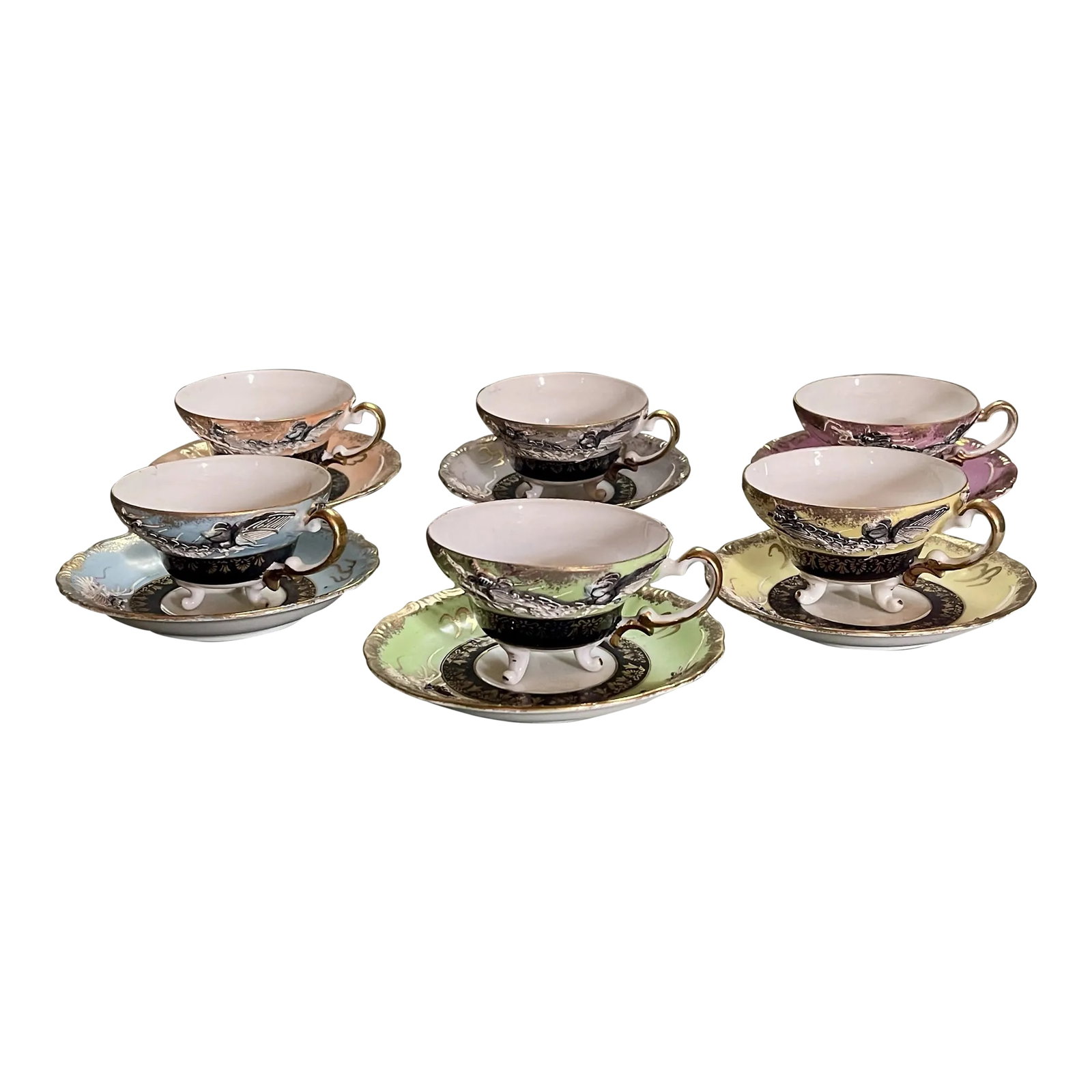 Mid 20th Century Dragon Teacups & Saucers- 12 Pieces: A fancifully elegant set of cups and saucers in a dragon motif. -Teacups measure 2 1/4 inches tall, 4 1/2 inches wide from handle to rim and 2 1/4 inches wide at the bottom. -Saucers measure 5 3/4