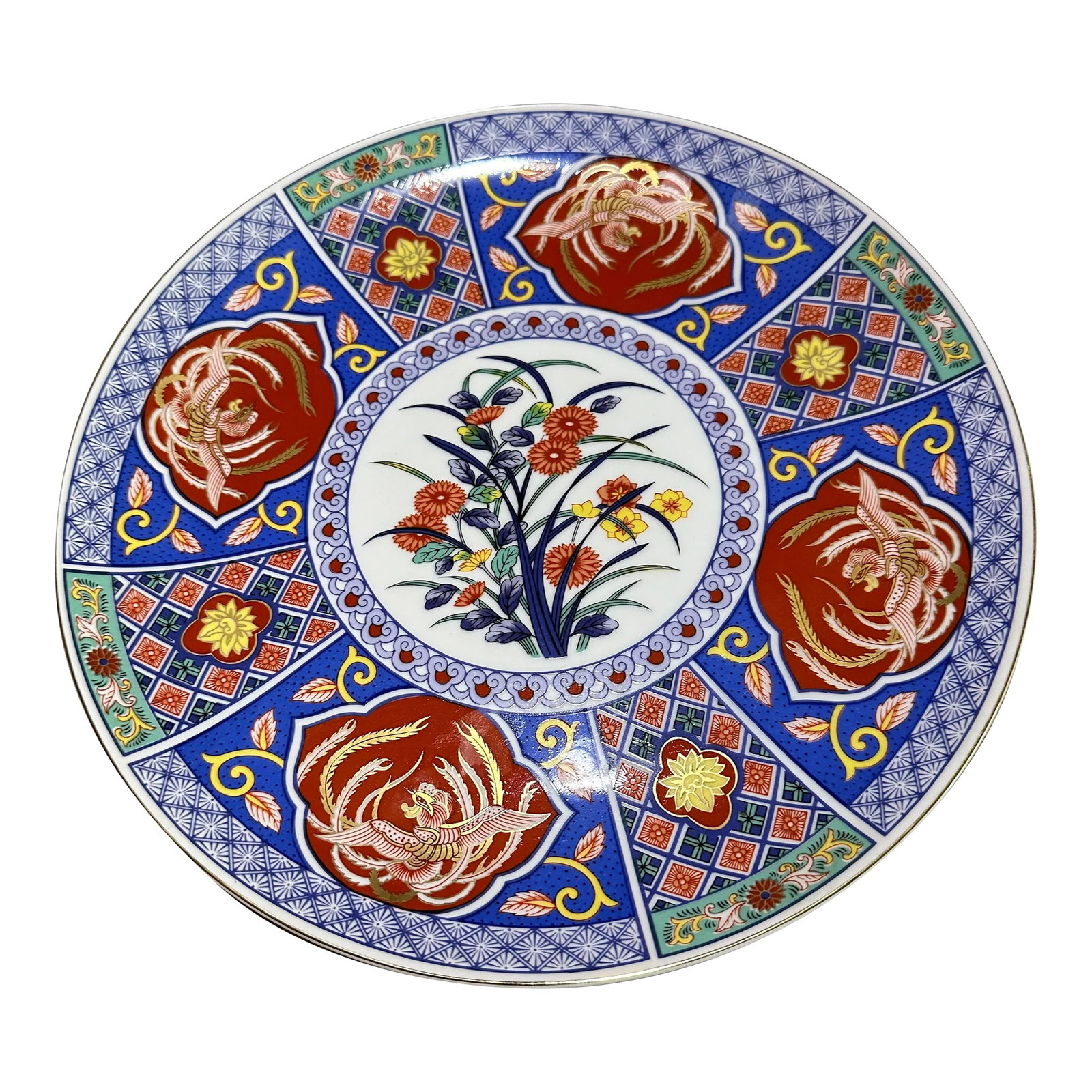 Large 1960s Decorative Japanese Platter in Blues, Greens and Rust Orange: A large round platter decorated with. Floral motif in the Japanese style. Excellent shape. 20th century Condition: Alterations: Original Condition Unaltered Imperfections: Some Imperfections