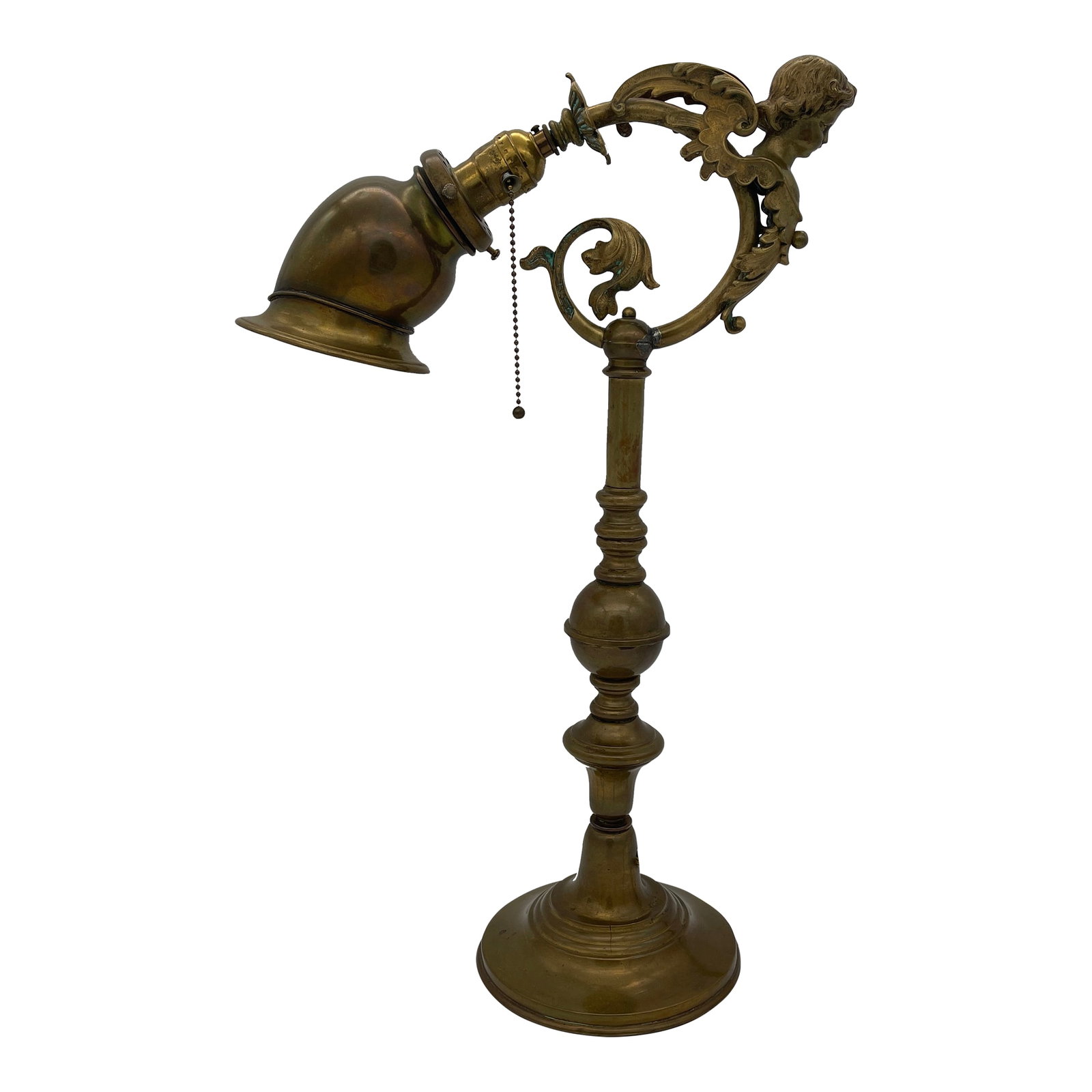 Late 19th Century French Brass Figural Desk Lamp: Incredible Late 1800s-Early 1900s French Brass Desk or Library Reading Lamp. Turned Brass standard, figural Cherub or putti caryatid arm with stills and Foliate ornamentation. Chain Pull socket, UNO