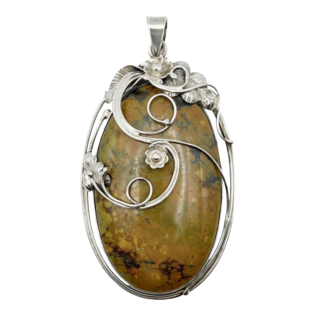 Vintage Spiderweb Turquoise Set in Sterling Silver Pendant: A lovely sterling silver setting for spiderweb turquoise in the shape of an oval. Sterling silver flowers and leaves create a delicate adornment for the beautiful gemstone. The bale has the makers