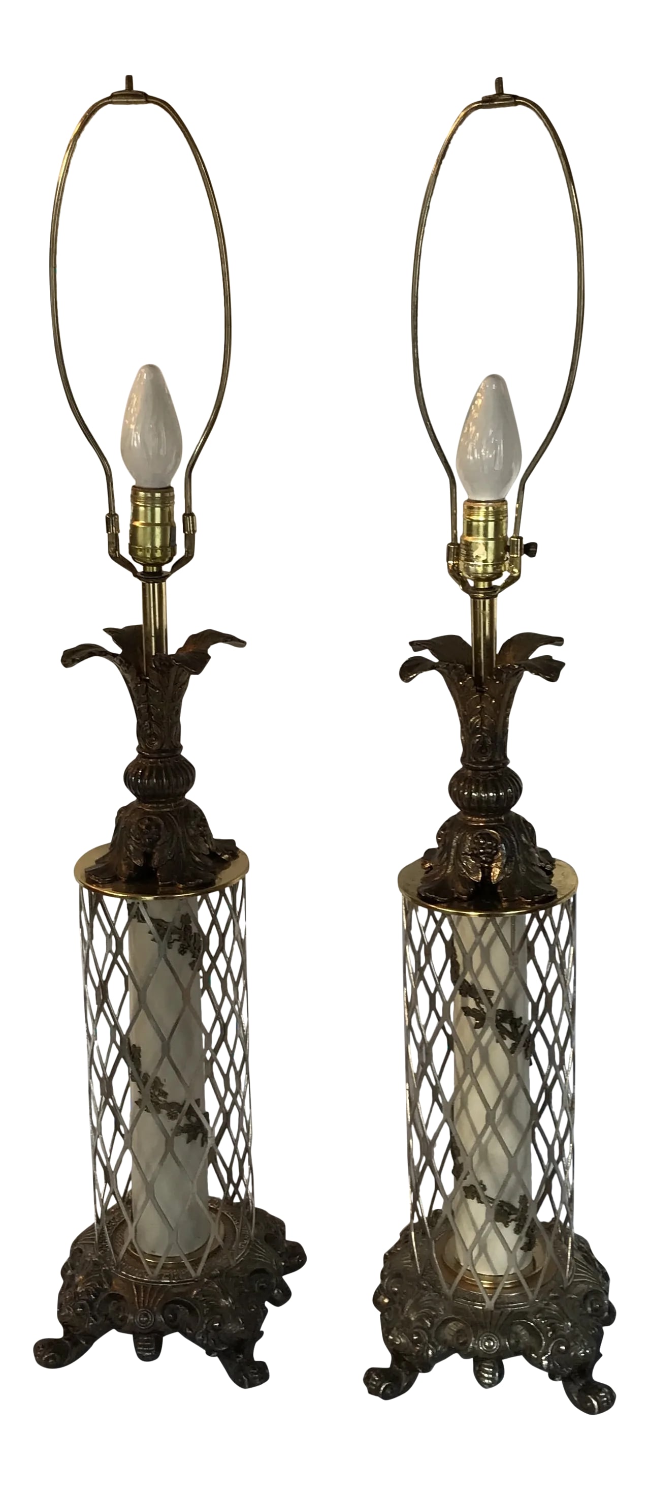 Rococo Traditional Metal Lamps - a Pair: Diamond cut metal around a metal raised spiral fleurish decor in the center of lamp. Heavy bottom metal scroll base and pineapple top design. The lamps measurements are 38 inches high with the harp