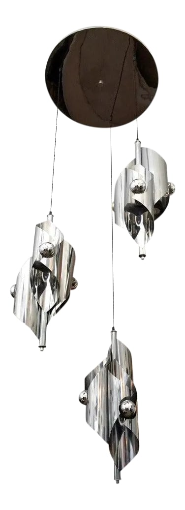 1960s French Pendant Light: A large French polished chrome sculptural nine-light chandelier with silk twisted cords and a polished circular canopy. Rewired. Condition: Alterations: Restored Imperfections: Some Imperfections