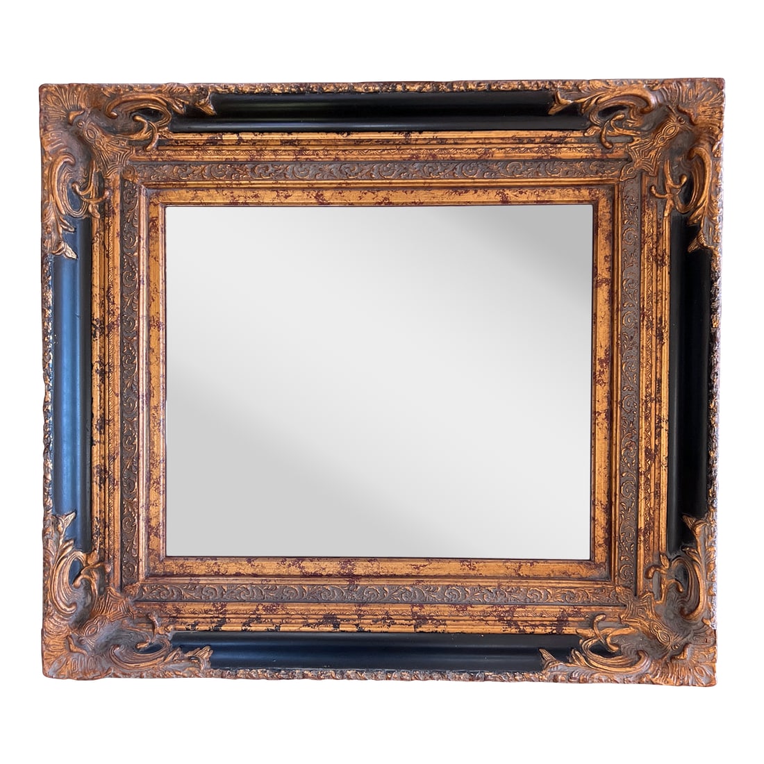 Spanish Baroque Gold and Black Mirror, Late 20th Century: Ornate Bronze Gold and Black Decorative Wall Mirror Beautifully adorned wood and plaster frame is hand painted with shades of dark brown to black glaze, bronze shades of gold, and dark red detailing.