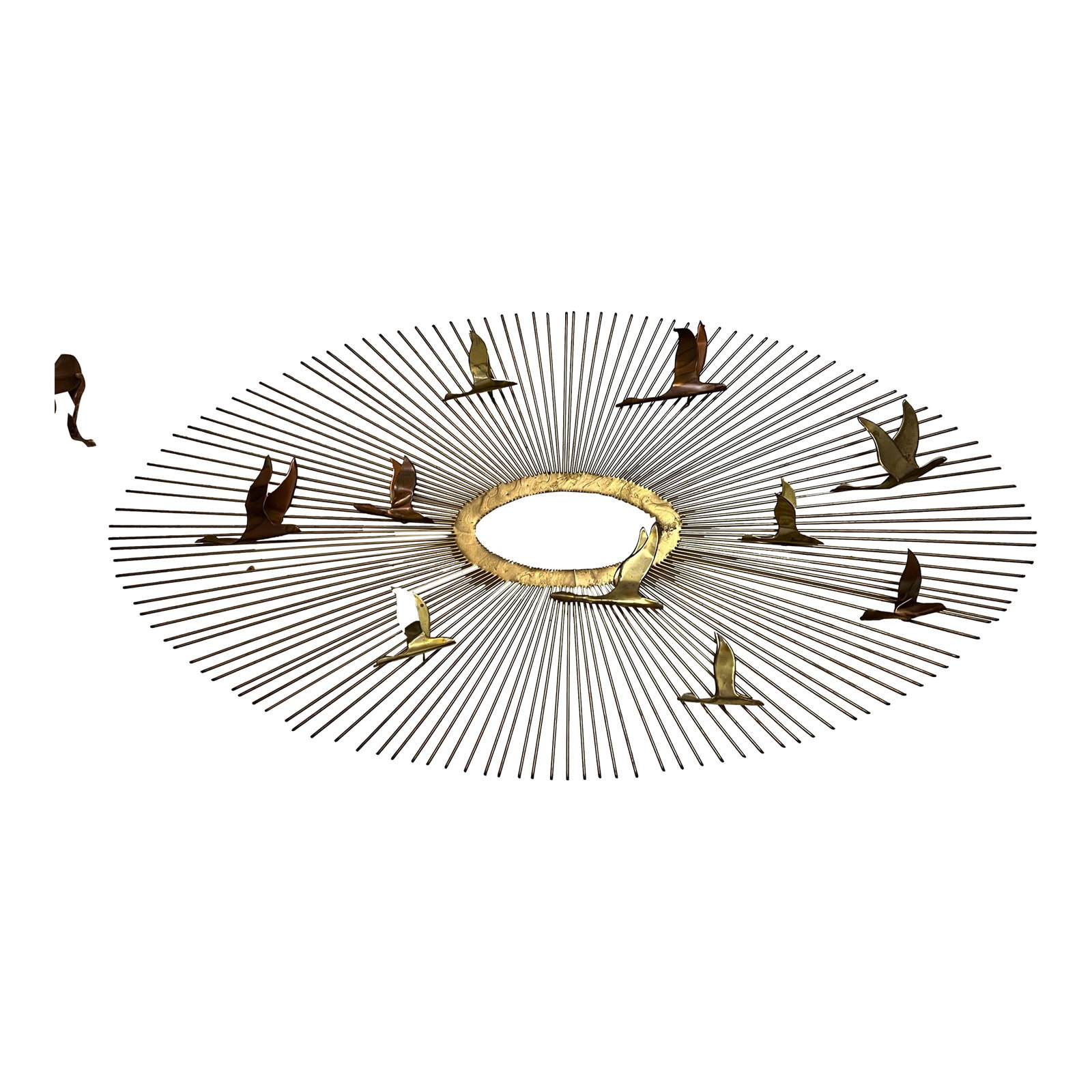 Mid Century 'Birds in Flight' Brass Sunburst Wall Sculpture Curtis Jere Style: A beautiful mixed-metal starburst and birds hanging wall sculpture attributed to Curtis Jere. This eye-catching piece in shades of bronze, gold and copper would especially add character over a firepla