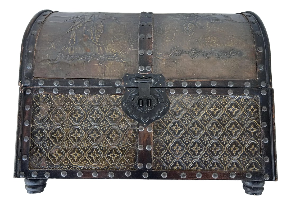 Mid 20th Century Vintage Decorative Wood Dome Box: Vintage Decorative Dome top footed chest. The pirate style chest is covered with pieces of Art Nouveau style Embossed Metal. The box is 12" x19" x 15.75" and on feet that are about 1.25" tall. The top