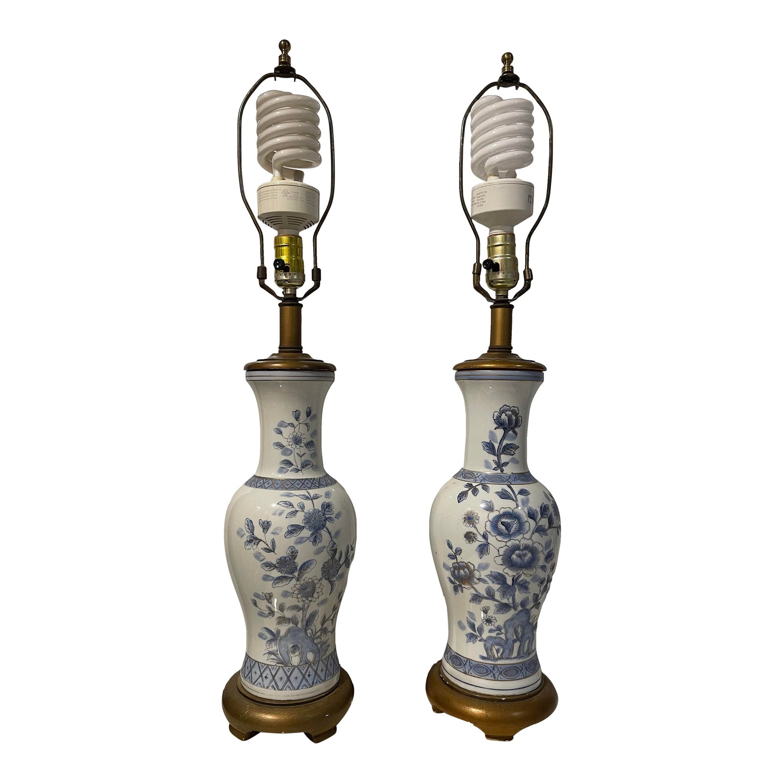 Pair of Vintage Blue & White Floral Coordinated Hand-Painted (Gold Accent) Lamps: A classy, coordinated pair of blue & white hand-painted table lamps. As each is hand/painted and unique, these are non-identical but coordinate well together. Lovely gold outlines the floral details.