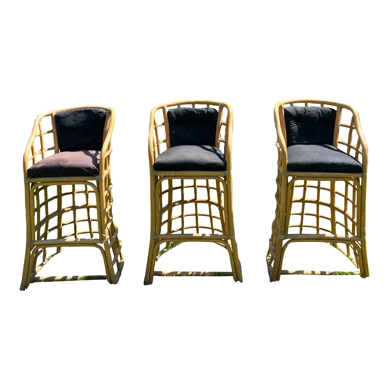 1970's Bamboo Bar Stools - Set of 3: These three retro barstools can bring great tiki bar vibes with their unique modernist design in the style of Paul Franko. The base is sturdy and the back and arms provide relaxing support for fun bac