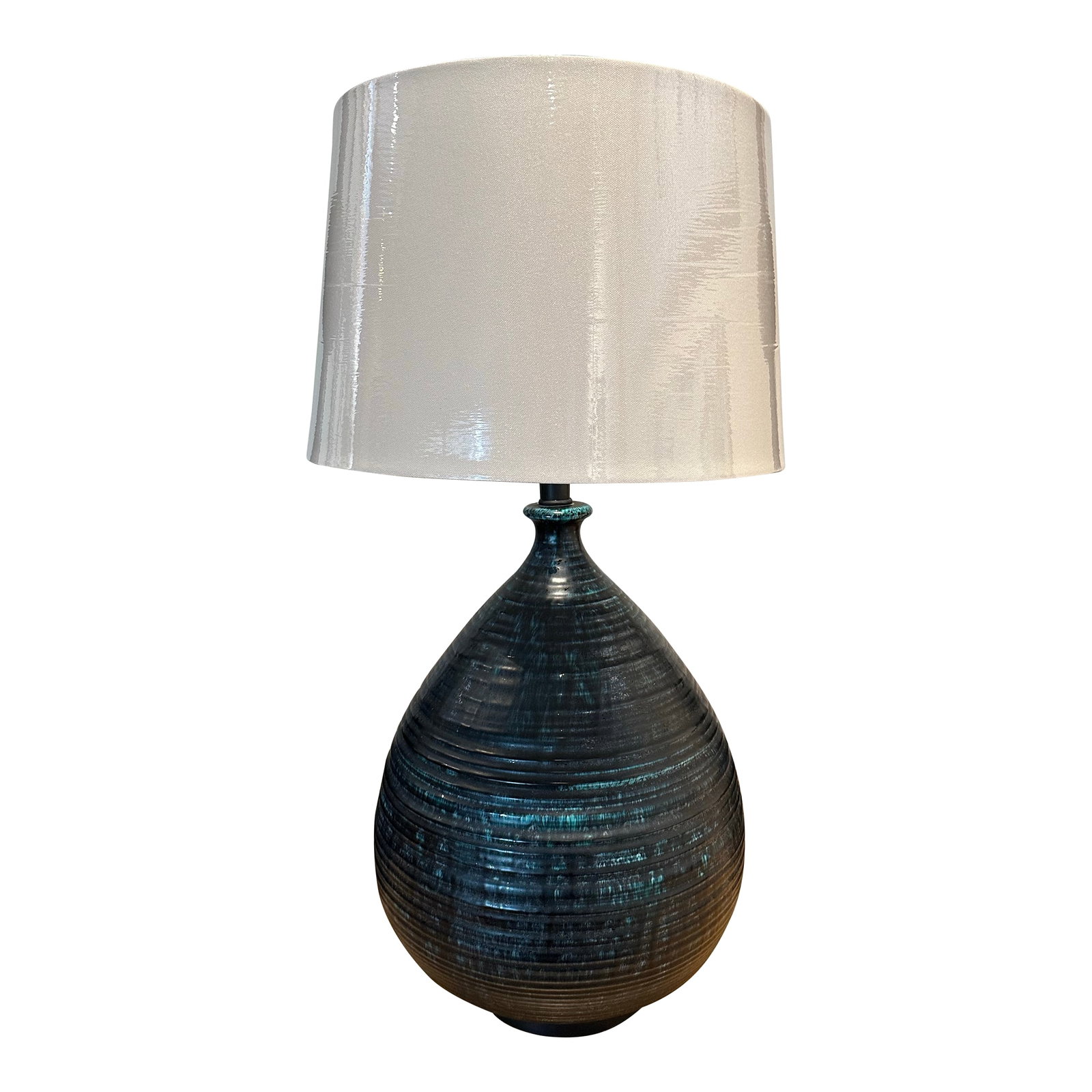 Ceramic Wide Bottom Blue Lamp. Drip Glaze Hand Thrown Body. Deep Blues.1966: Generous in shape and color. Blue drip glaze. I recommend a larger shade with this. It is 29" tall to the top of this finial. With a 2.5" brass finial. 13" wide at the girth. Marked '66 on the base.