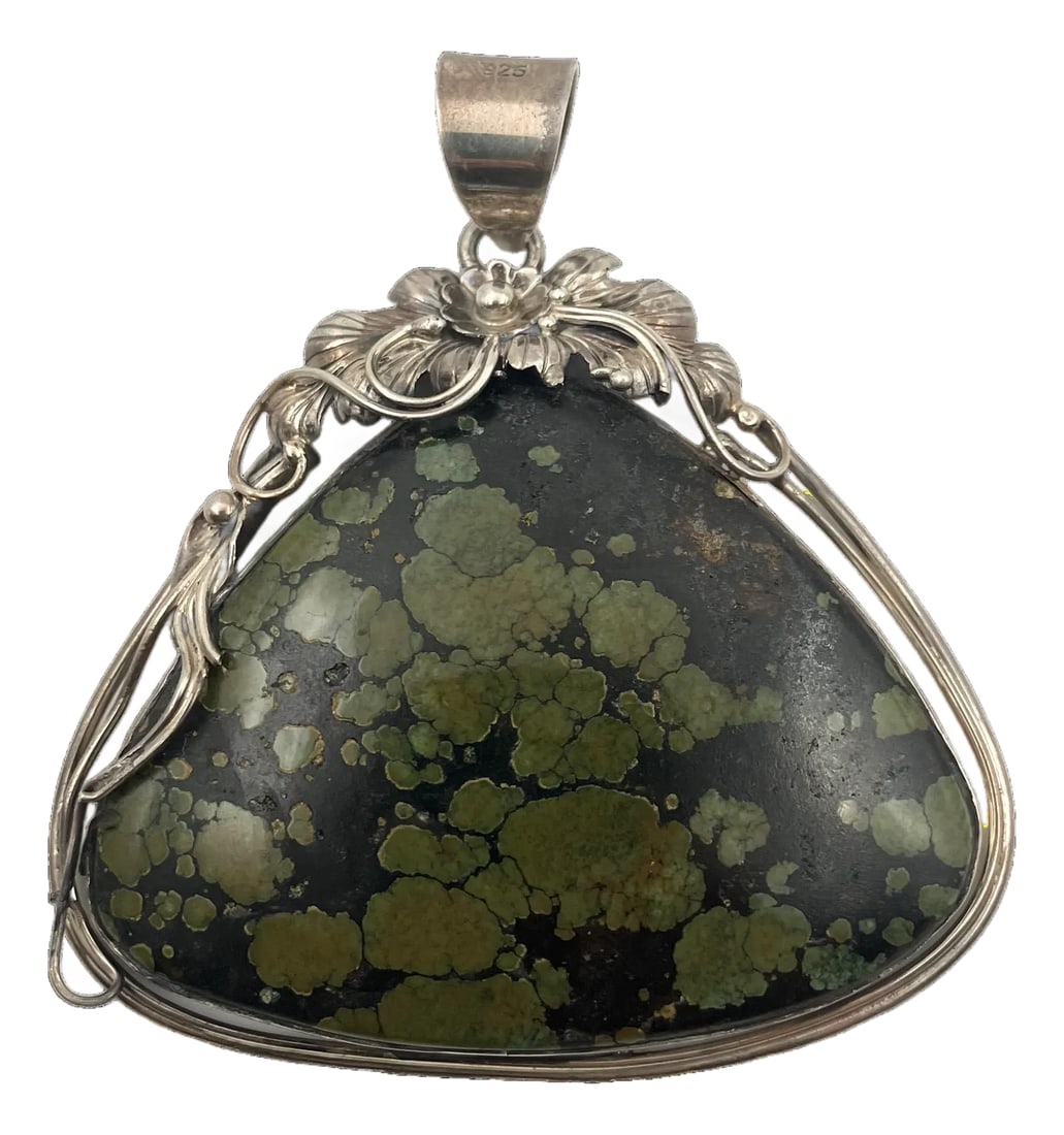 Vintage Spiderweb Turquoise Sterling Silver Pendant: A lovely sterling silver pendant with unique spiderweb turquoise colors, of green, brown and hints of yellow and turquoise blue, in a triangular shape. It is a sterling silver setting with bevel set