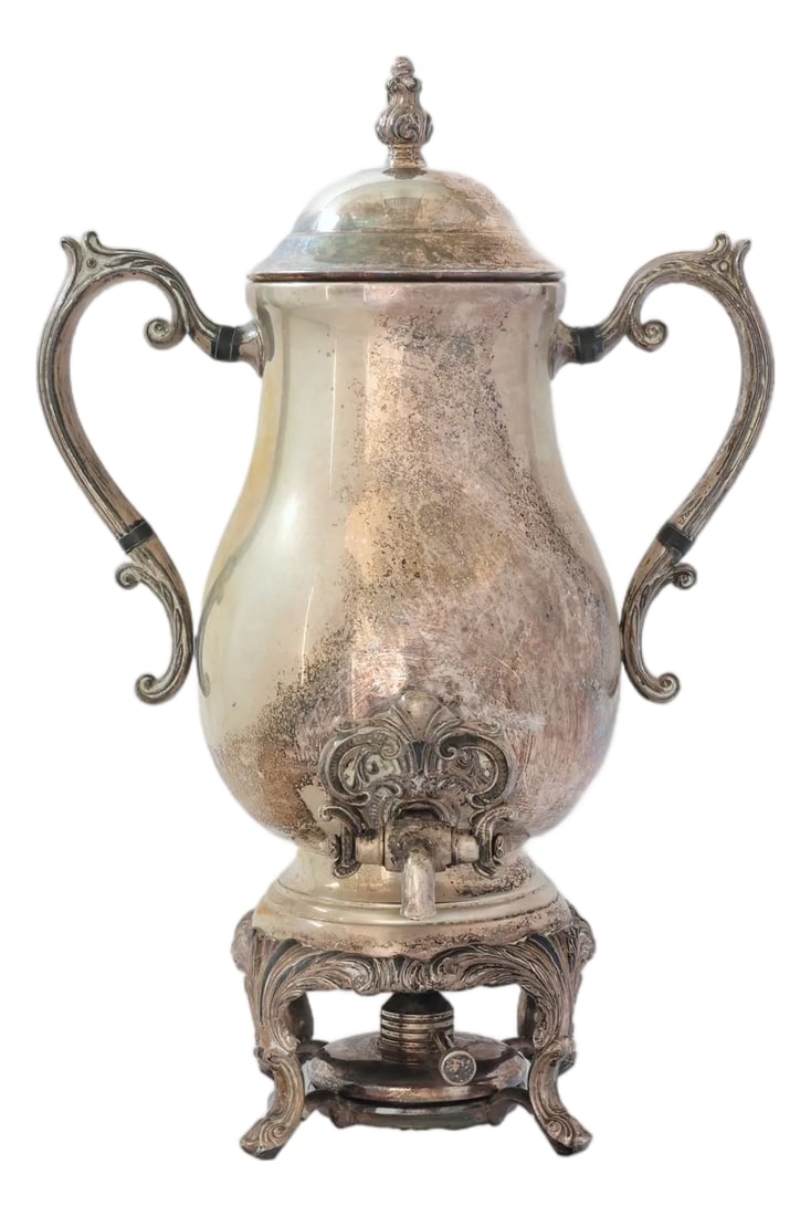 1960s Rogers Silver-Plate Beverage Urn: Iconic FB Rogers silver-plate coffee urn, made in the USA, circa 1960s. This sought-after form was famously repurposed as a trophy by sporting clubs and universities. Features Rococo handles, ornate