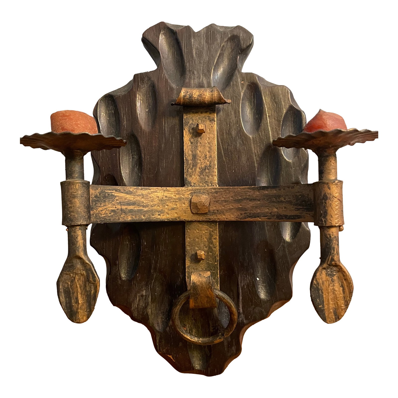 Vintage Wrought Iron and Carved Wood Wall Sconce: Vintage wall sconce, mixed metal with two candles on thick 1" hand carved wood mounting. Centrally located below rests a single metal ring. Candles are used, complementing the aged decor. The item is 