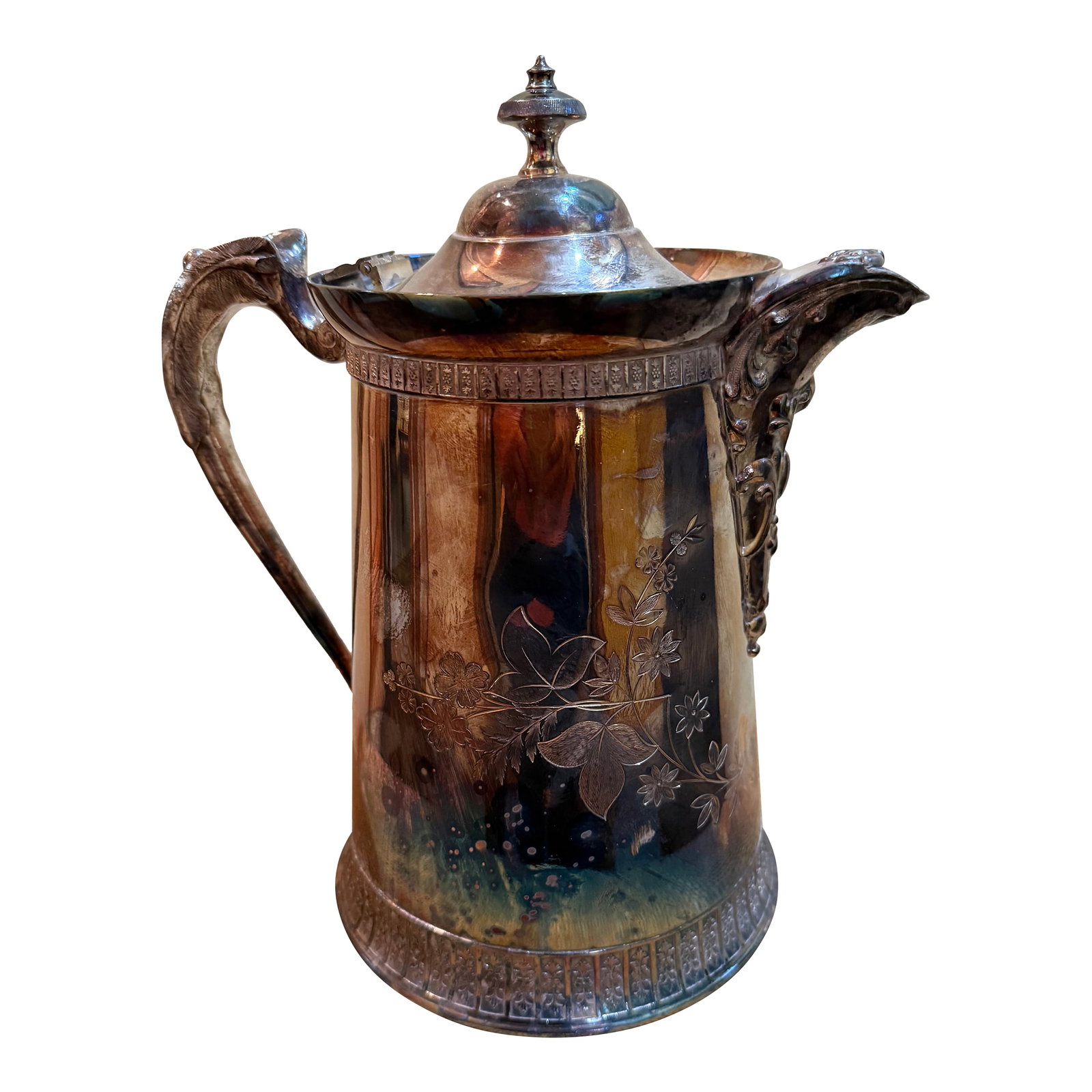 Late 19th Century Victorian Silver-Plate Insulated Water Pitcher: This antique silver plated hot water pitcher originates from the United States and dating to copyright date of "Nov, 1888" stamped on the bottom. It is crafted in period Victorian style. This