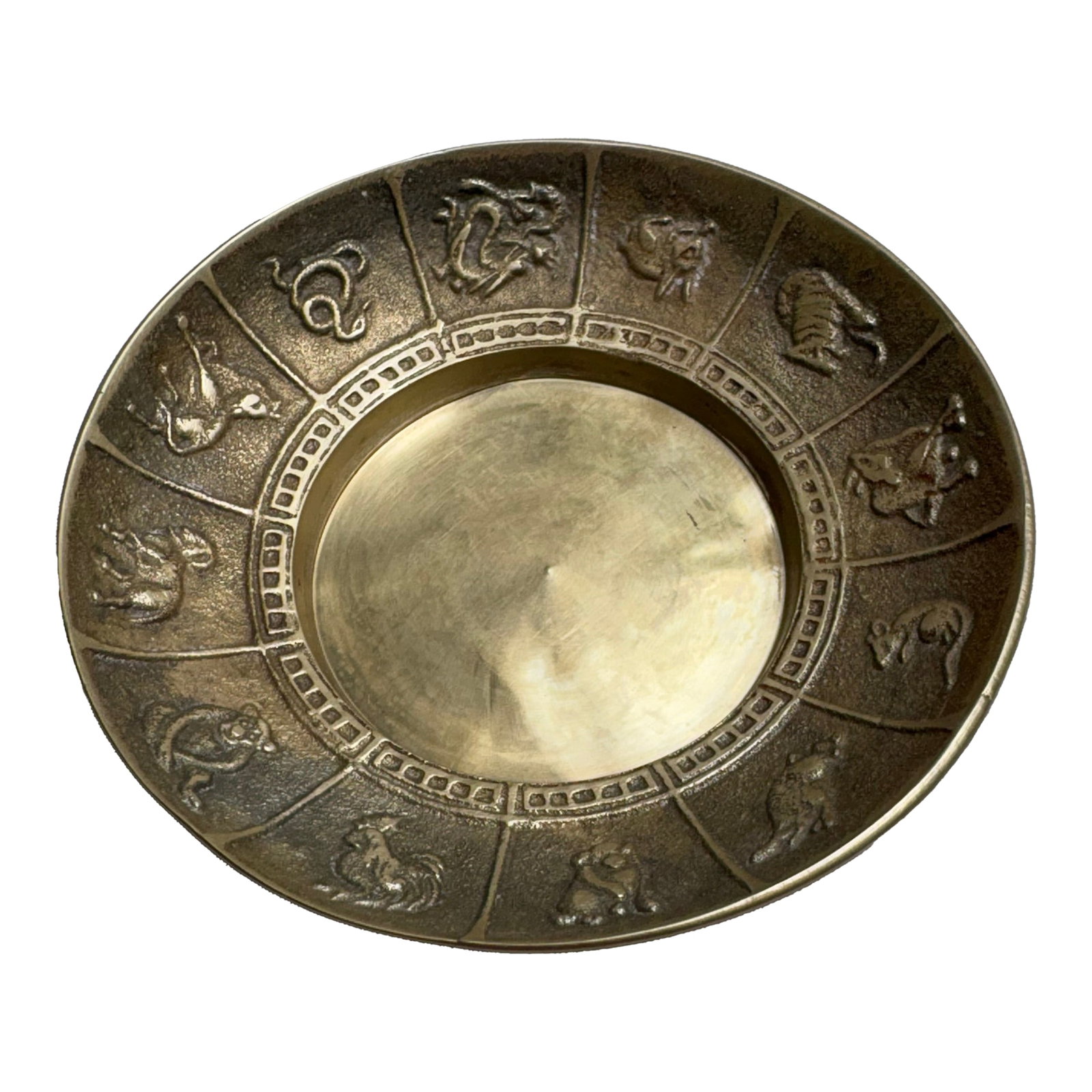 Diminutive Vintage 12 Month Zodiac Brass Bowl: This rare small heavy brass cast Zodiac bowl from the 6os shows each Zodiac sign that's raised in the stamp of the original brass casting. It depicts each sign in a artistic craftmanship that is lost