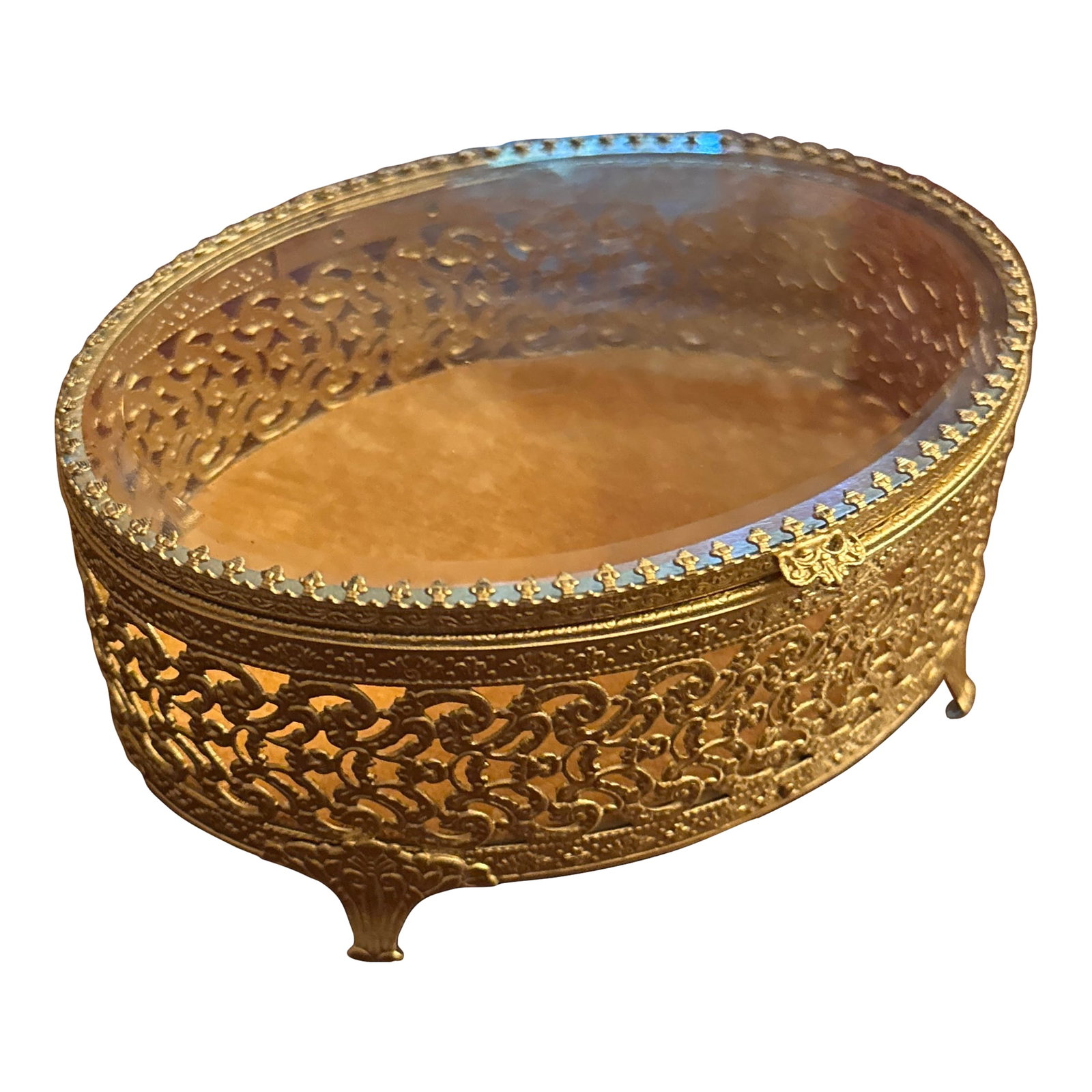 French Gold Reticulated Jewel Casket: French Louis XV Filigree gold vanity box or jewelry casket of oval form, with ornate rococo designs and scrolled feet with gold velvet bottom, hinged lid with original bevel glass and Fleur de lis pro
