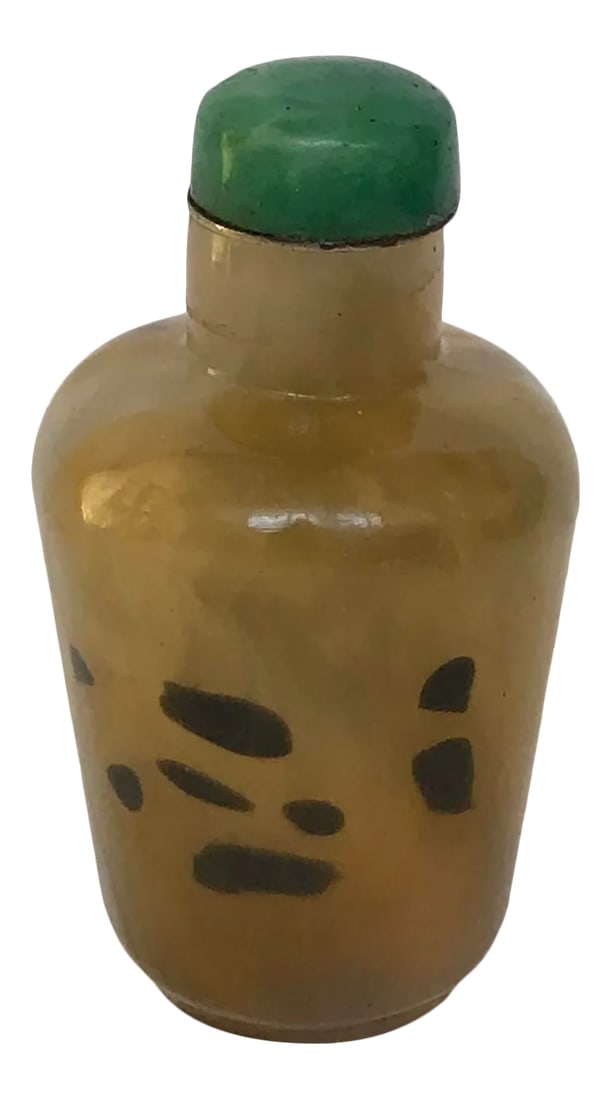 Vintage 1920s Sandwich Glass Snuff Bottle Imitating Shadow Agate: The Sandwiched Glass bottle has a elongated tapering cylindrical form. The light beige yellow glass is suffused with dark brown spots and lines of striations in strands of various shades of beige.