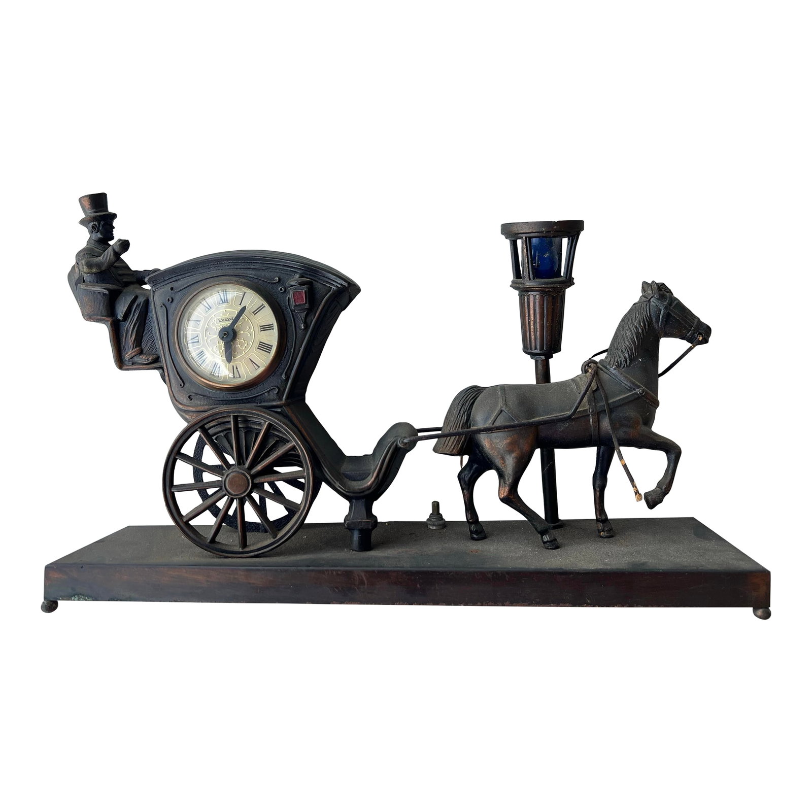 Vintage United Metal Goods Horse Carriage Clock & Lamp: Mid Century Horse Carriage Clock & Lamp marked United Metal Goods. Rare bar light works. Measures 16" x 4" and 10" tall. Condition: Alterations: Original Condition Unaltered Imperfections: Some