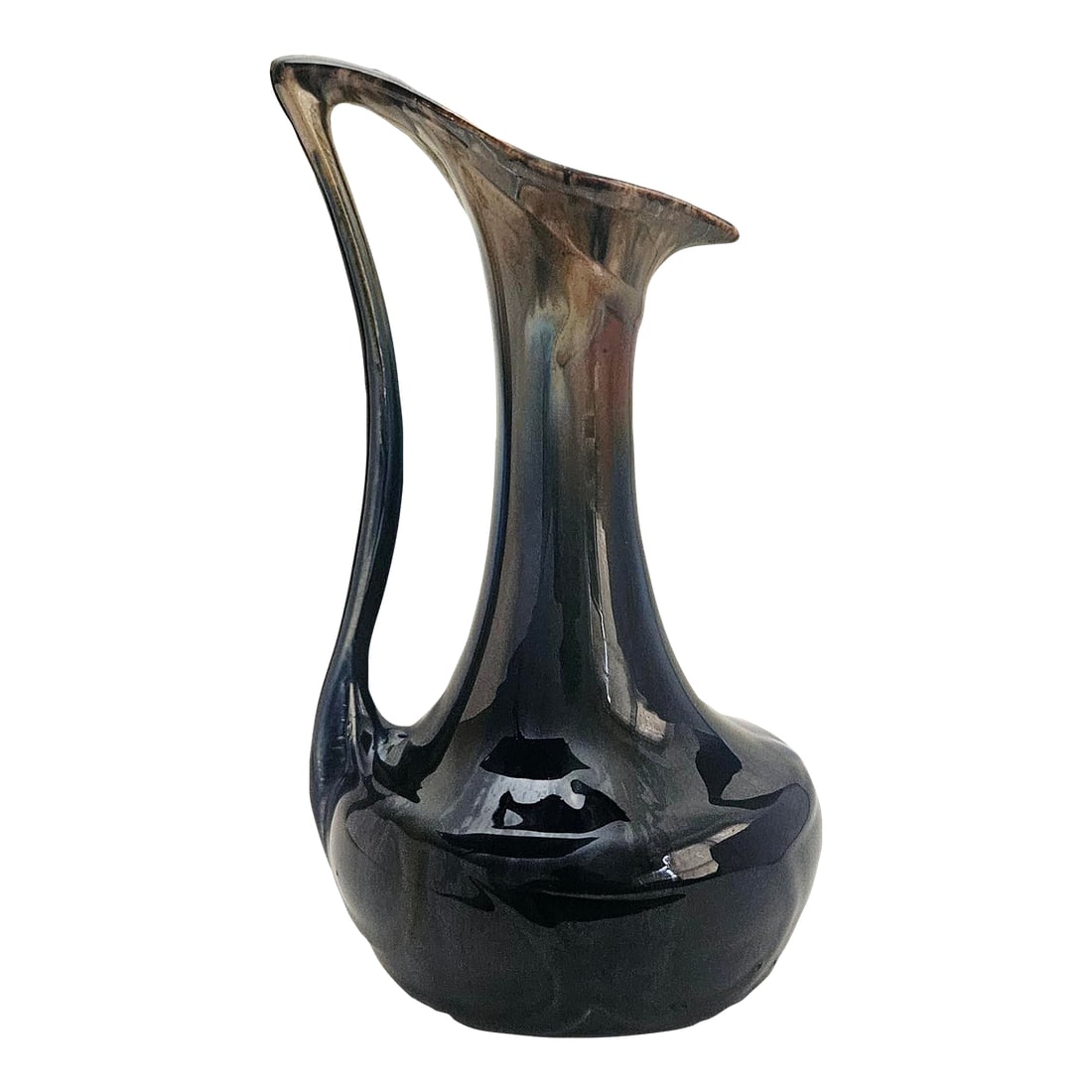 Early 20th Century Art Nouveau High Gloss Glazed Pottery Pitcher Attributed to Faiencerie De Thulin: This absolutely lovely ceramic ewer has swirls of deep blue and brown with drips of cream around the neck, mouth and the spout. The long slender neck has a handle curved to follow its arc. Shiny surfa