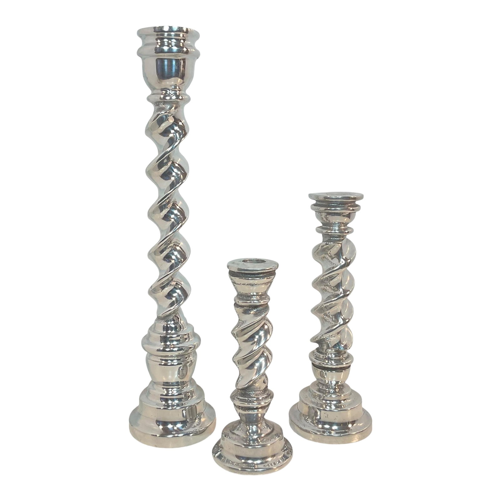 Set of 3 Polished Pewter Twisted Candle Holders 7"-14.5": This beautiful pair of Barley Twist candlesticks will blend well with any style decor. The candlesticks have a bright shiny finish. They are made from polished pewter metal. Made in Mexico. They are i